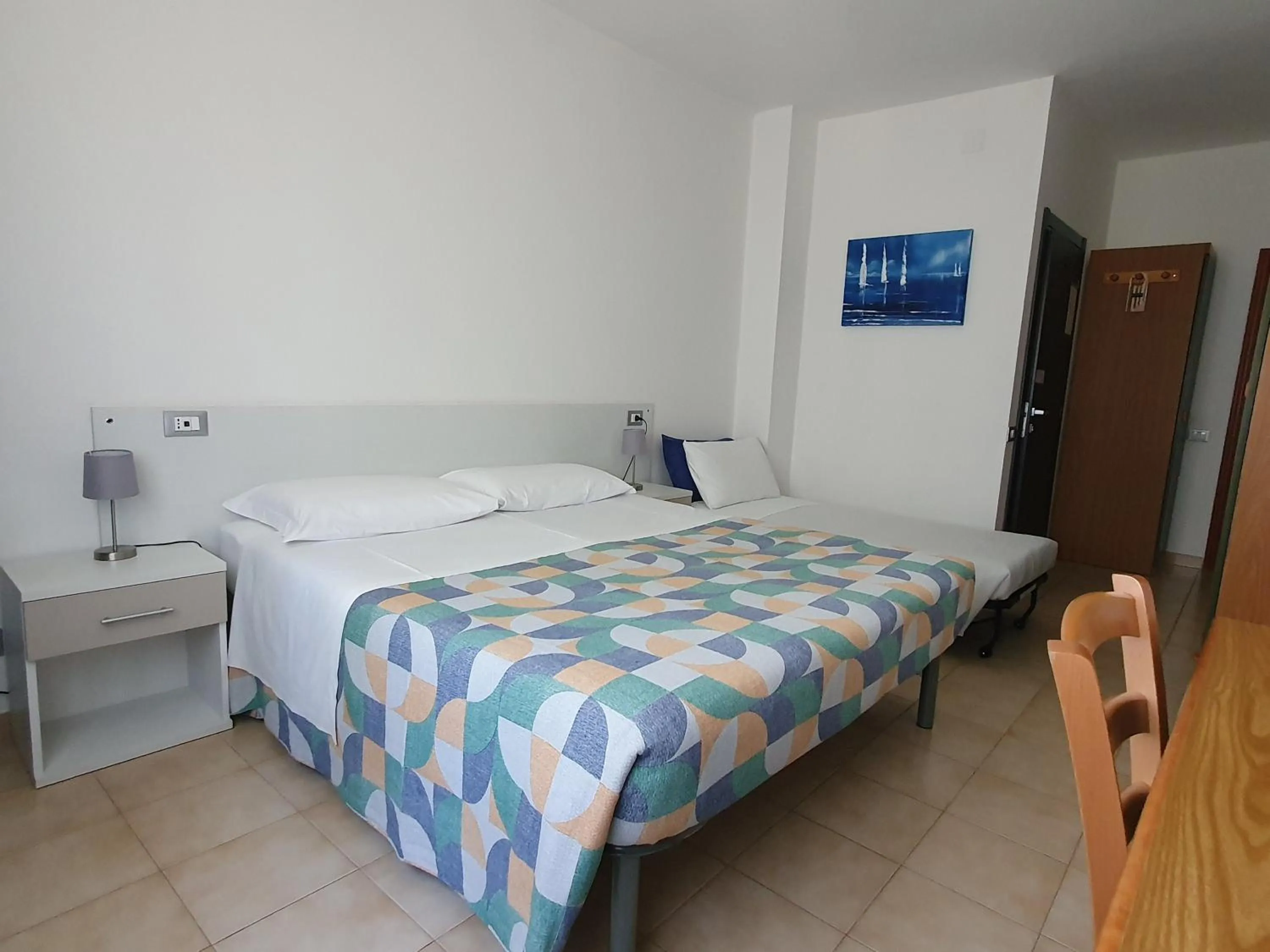 Bed in Hotel Cormorano