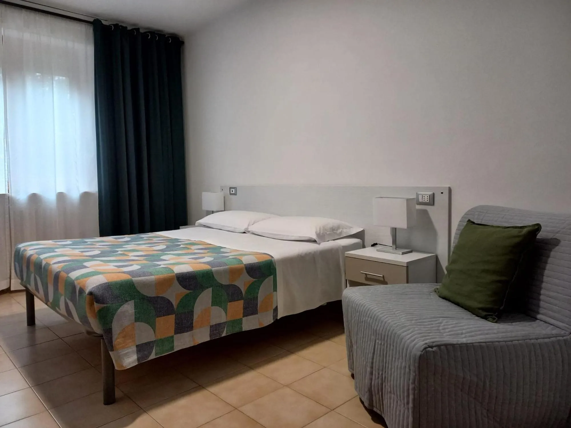 Bed in Hotel Cormorano