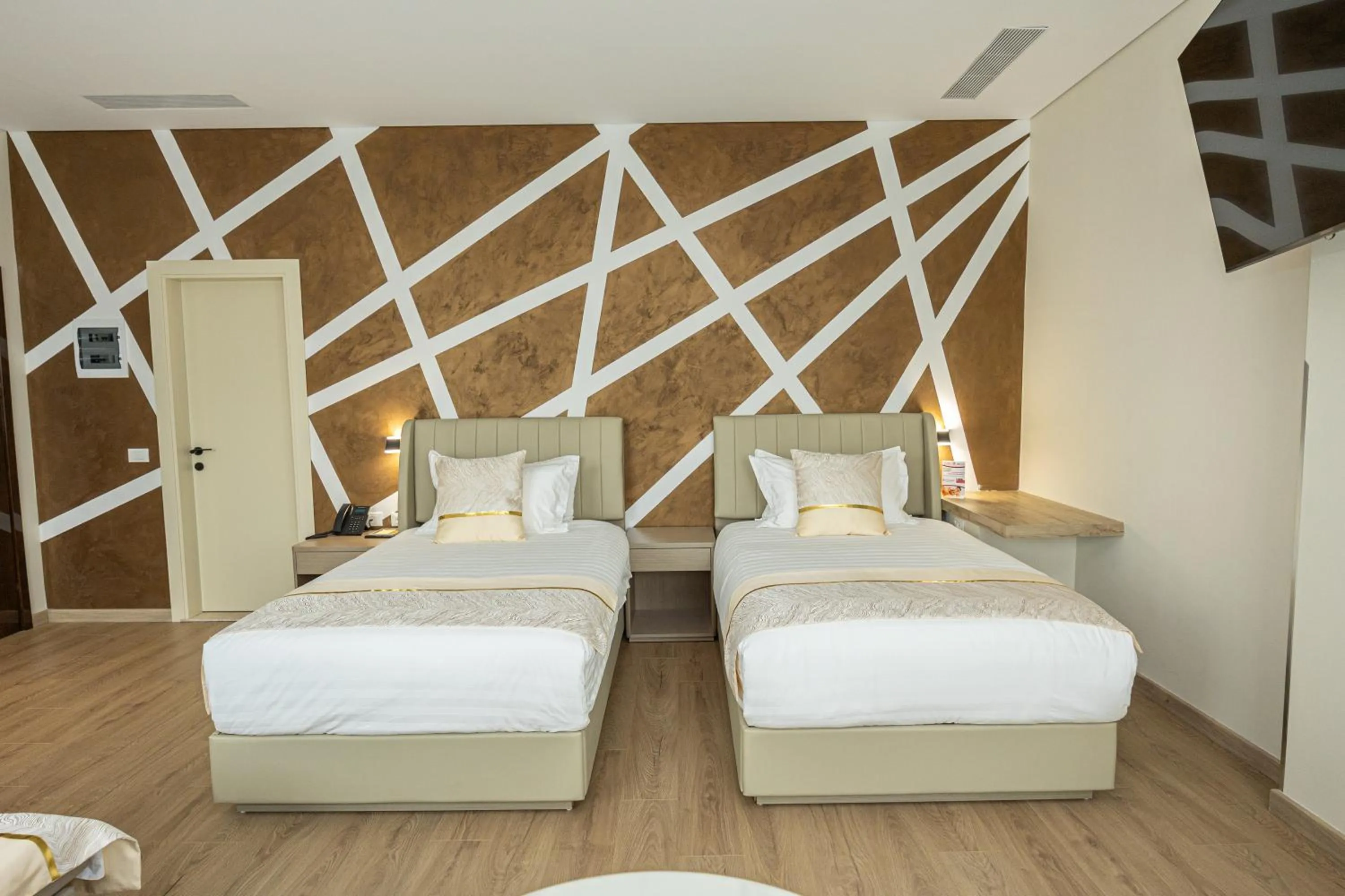 Communal lounge/ TV room, Bed in Sky Hotel Tirana