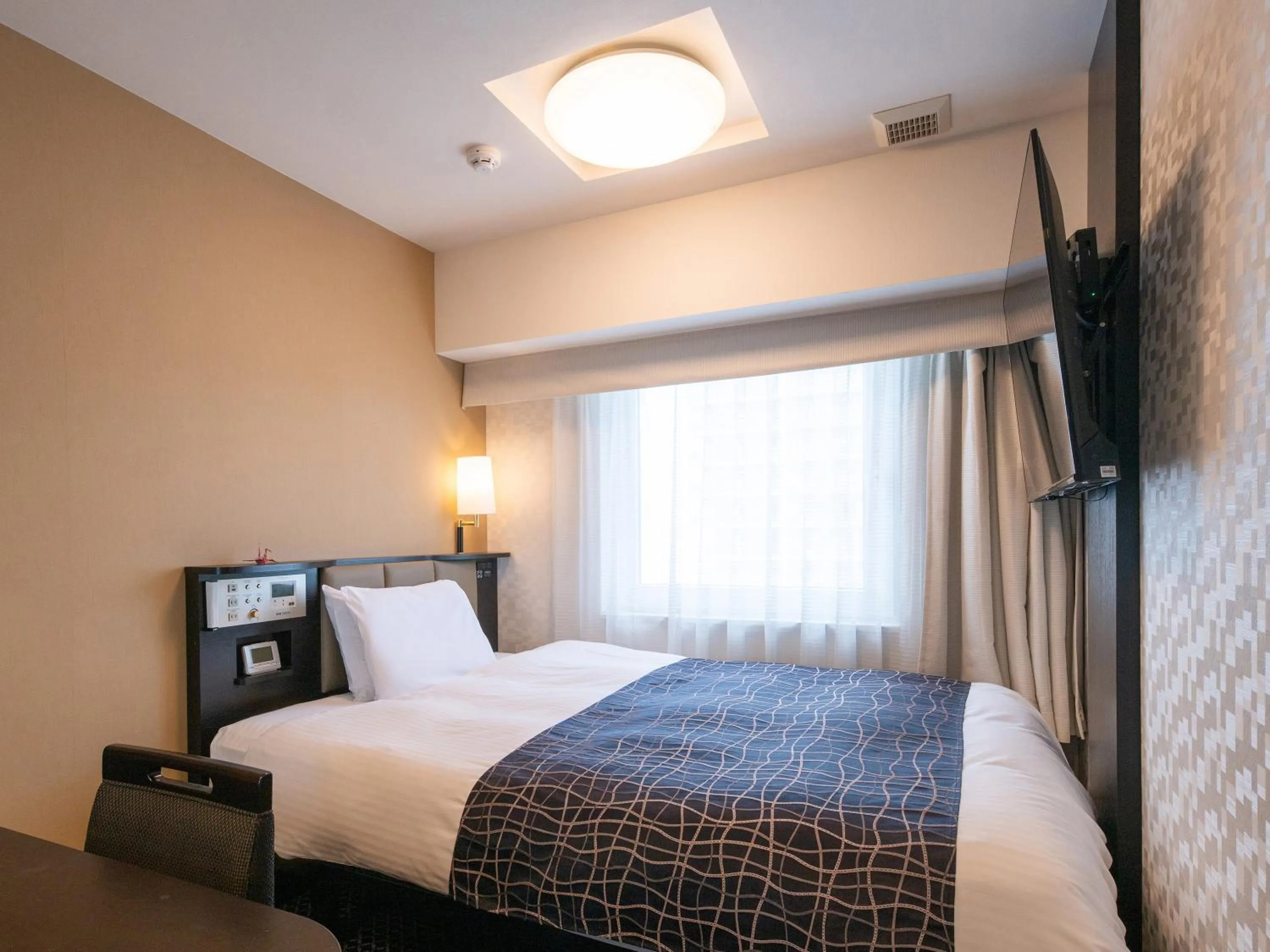 Bed in APA Hotel Nagoya Sakae Kita