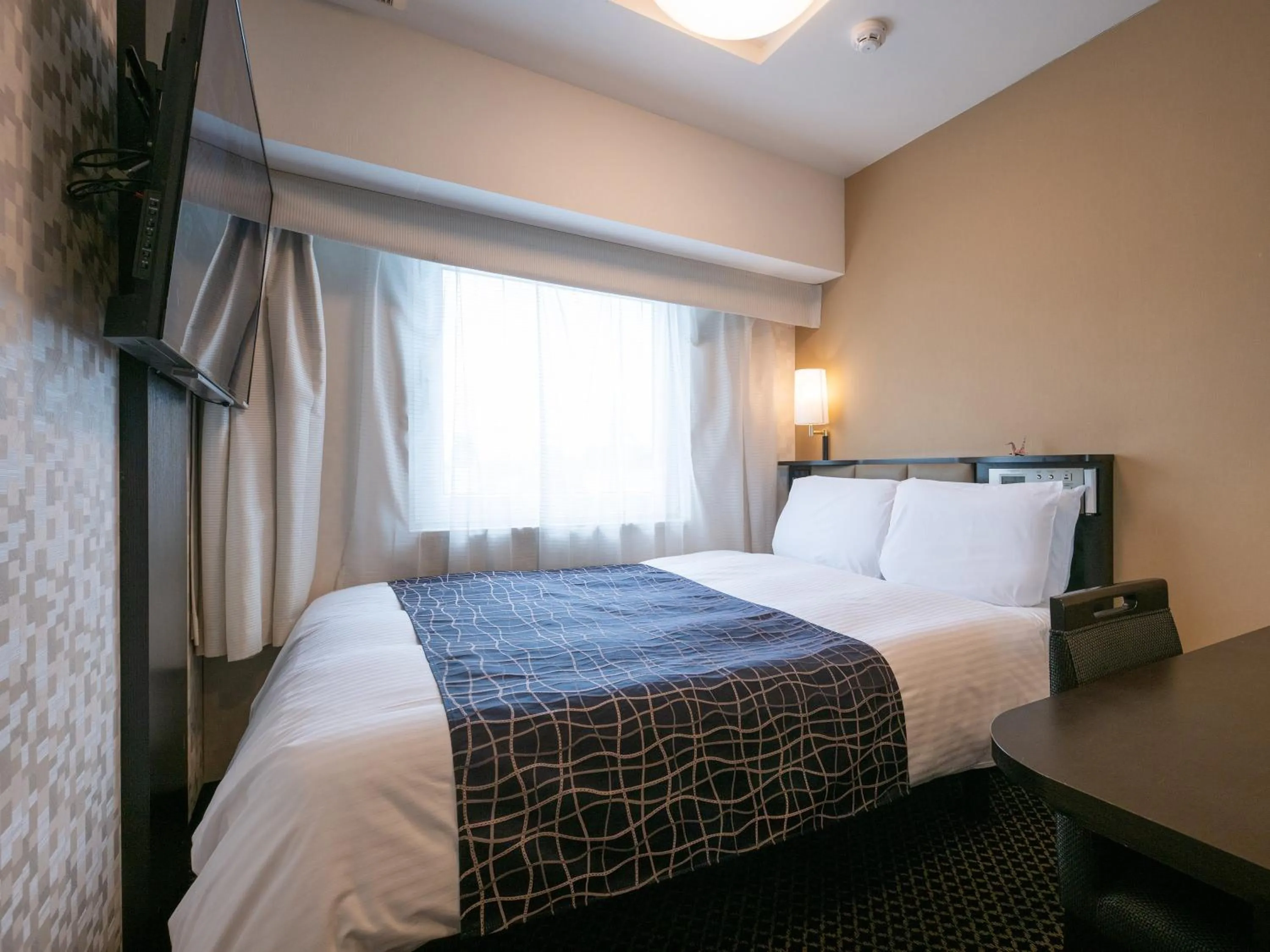 Bed in APA Hotel Nagoya Sakae Kita