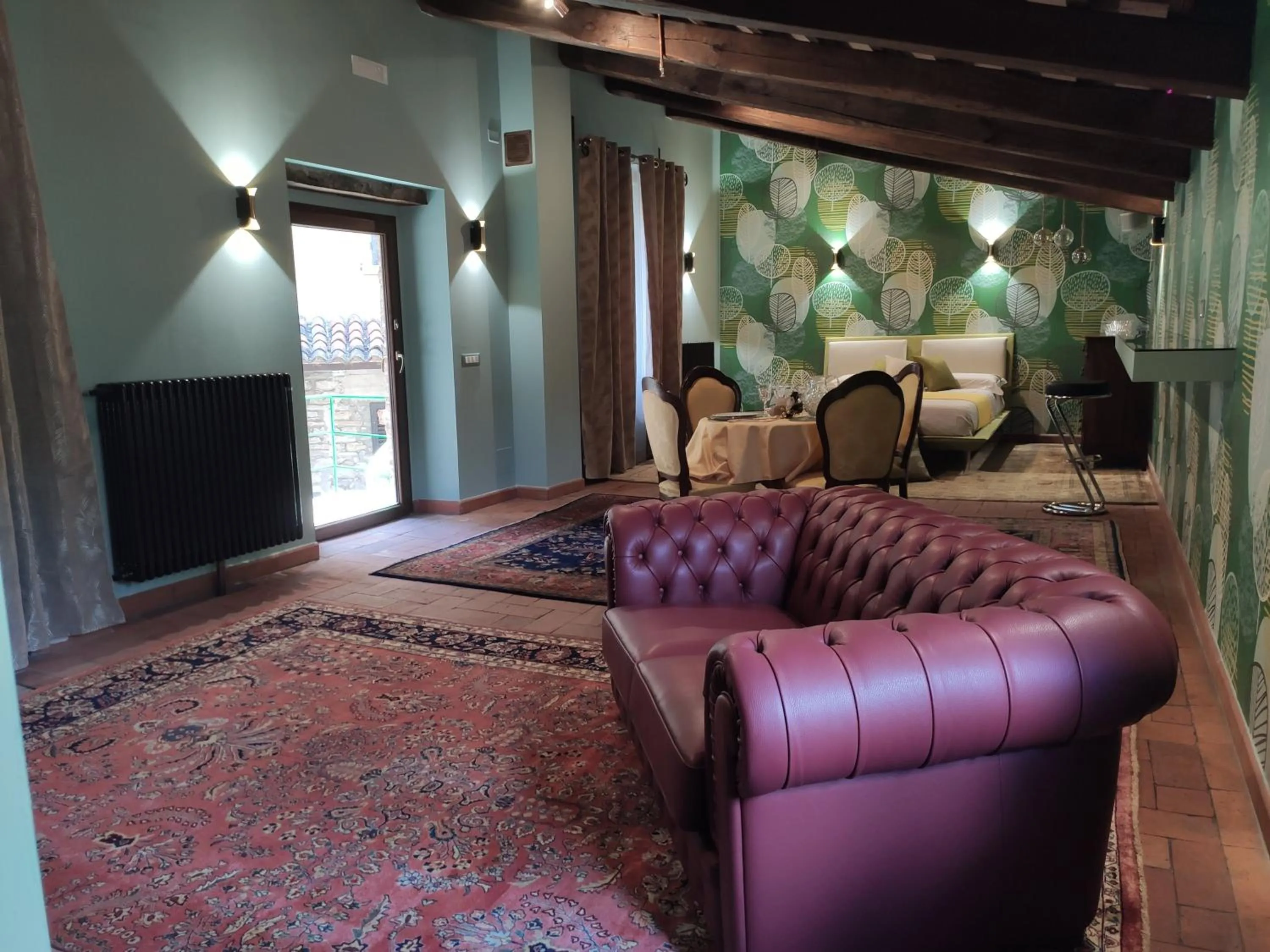 Communal lounge/ TV room in Villa La Nussa