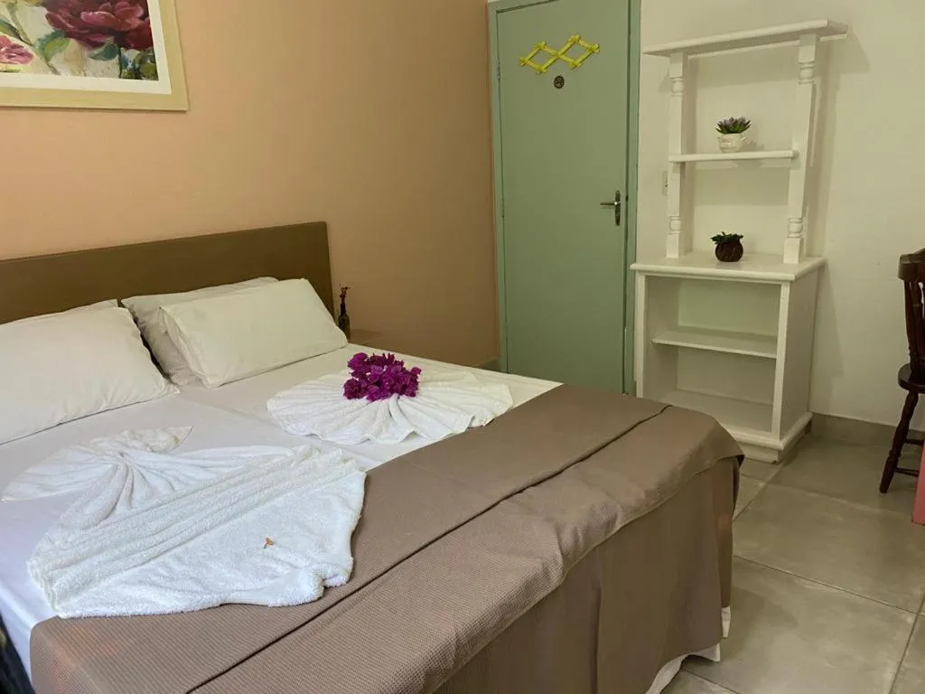 Bed in Pousada Liras da Poesia