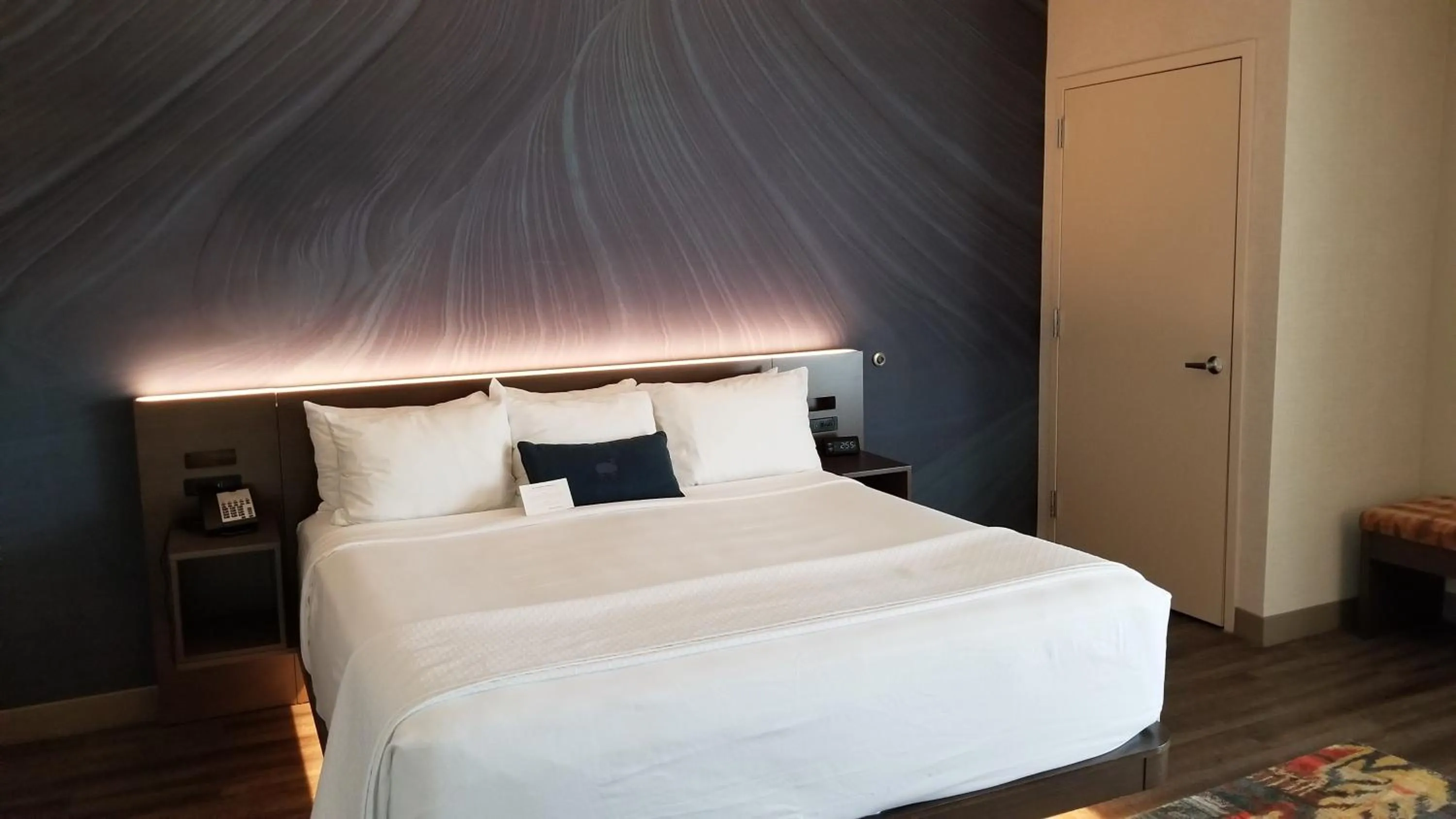 Bed in Cambria Hotel Omaha Downtown