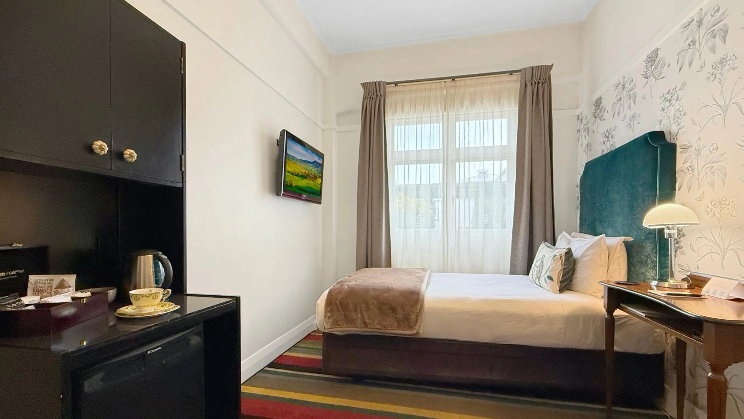 Bed in Art Deco Masonic Hotel