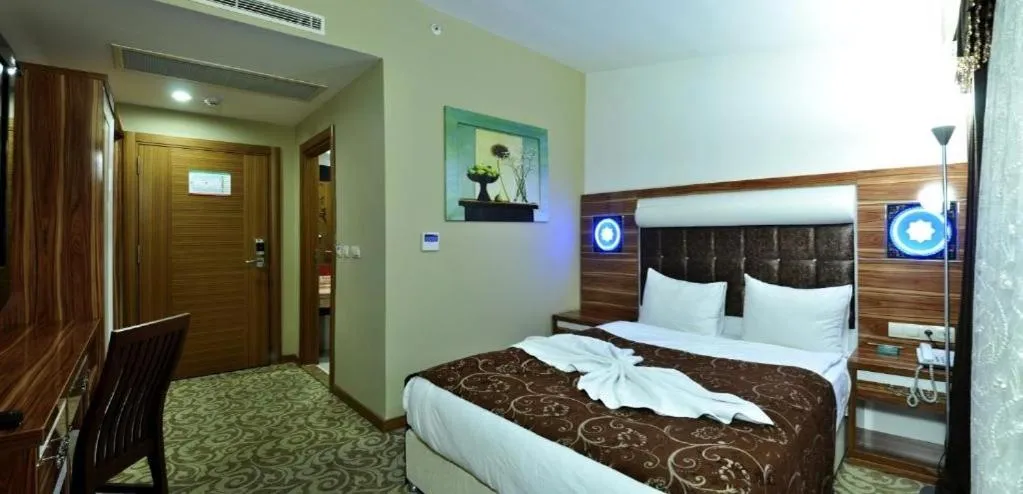 Bed in Demosan Hotel