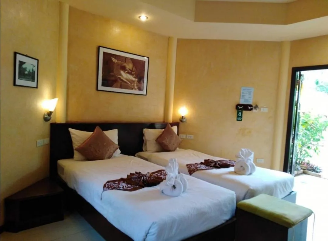 Bed in Palm Garden Resort