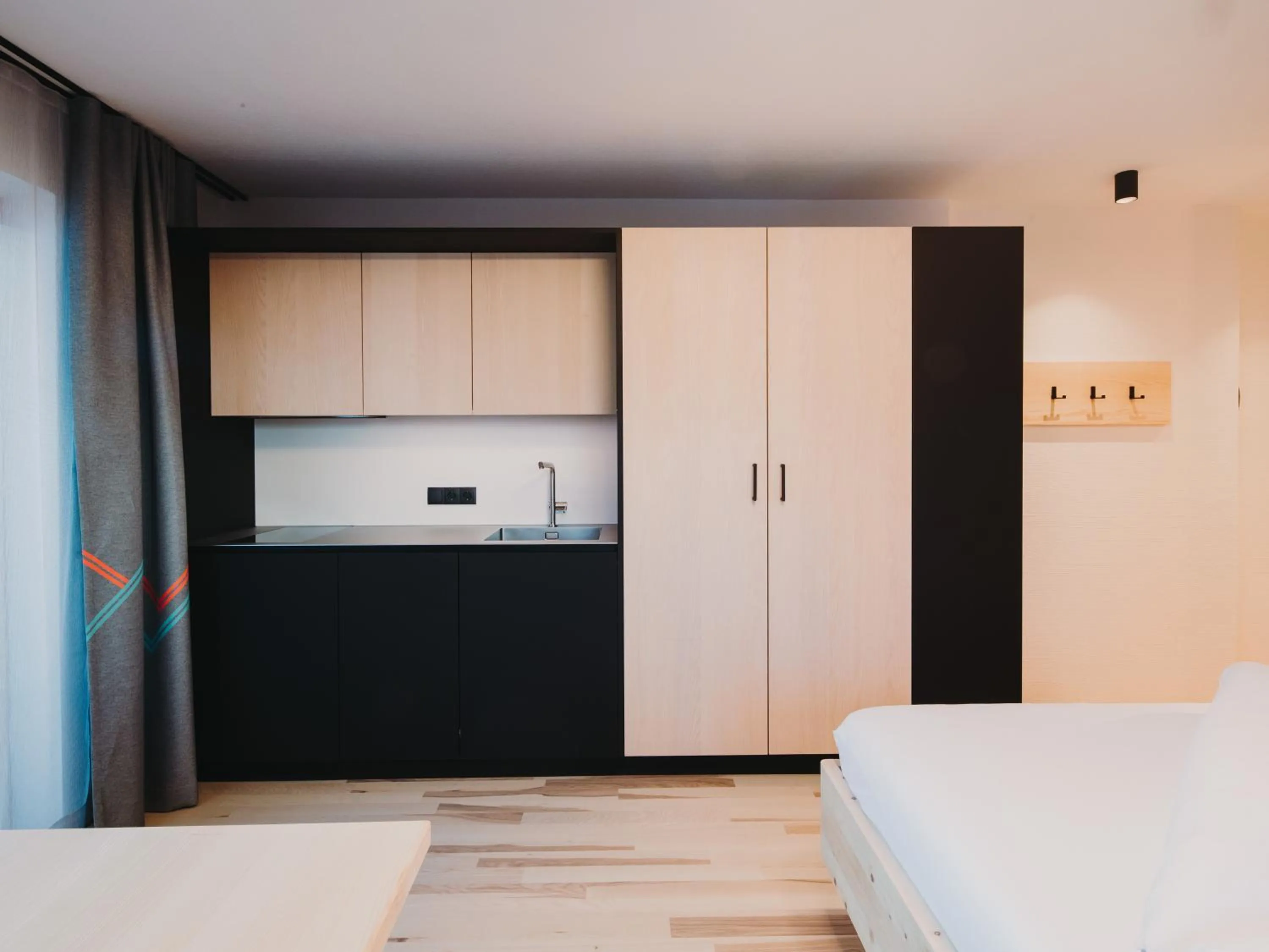 Kitchen or kitchenette, Bed in Alpin - Studios & Suites