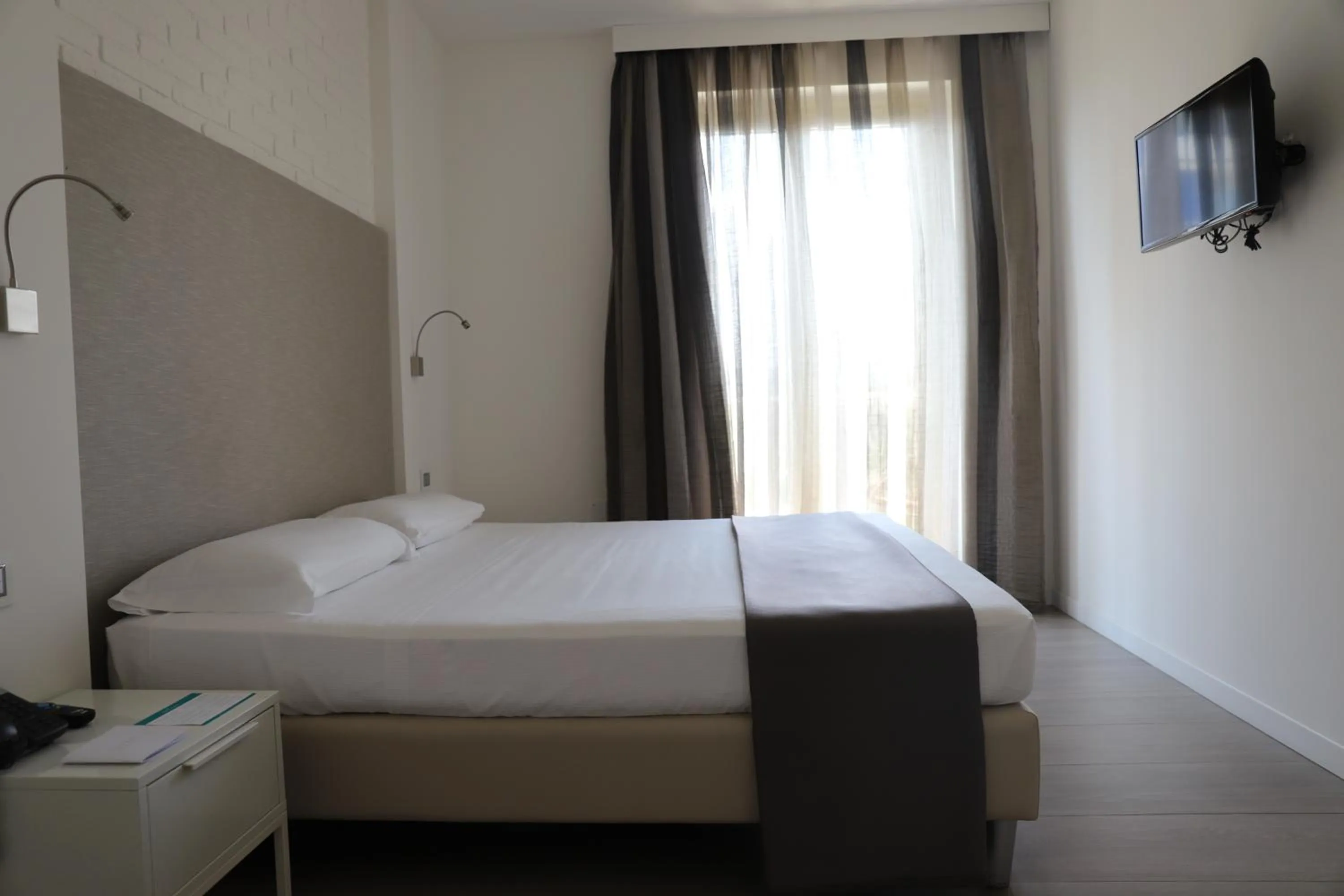 Bed in Smeraldo Suites & Spa