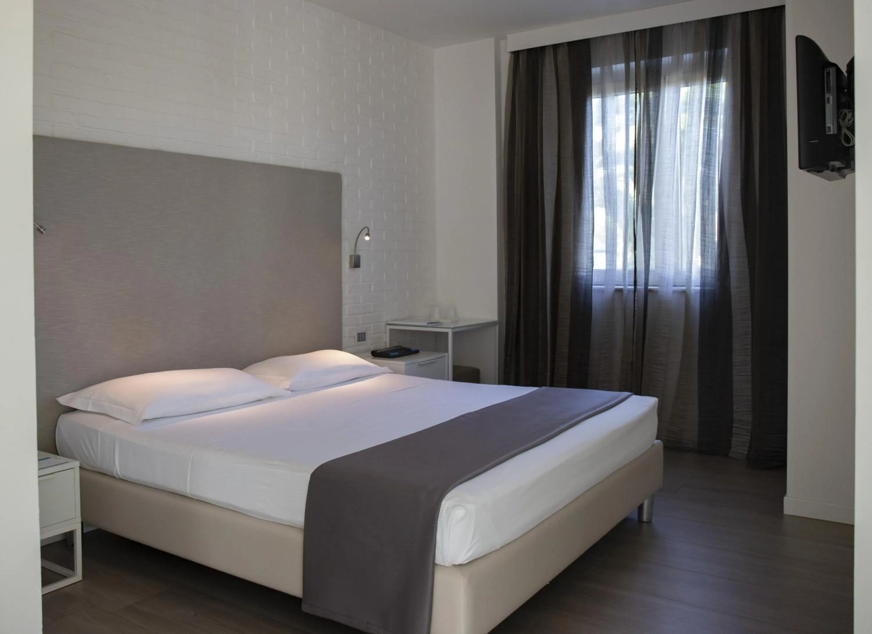 Bed in Smeraldo Suites & Spa