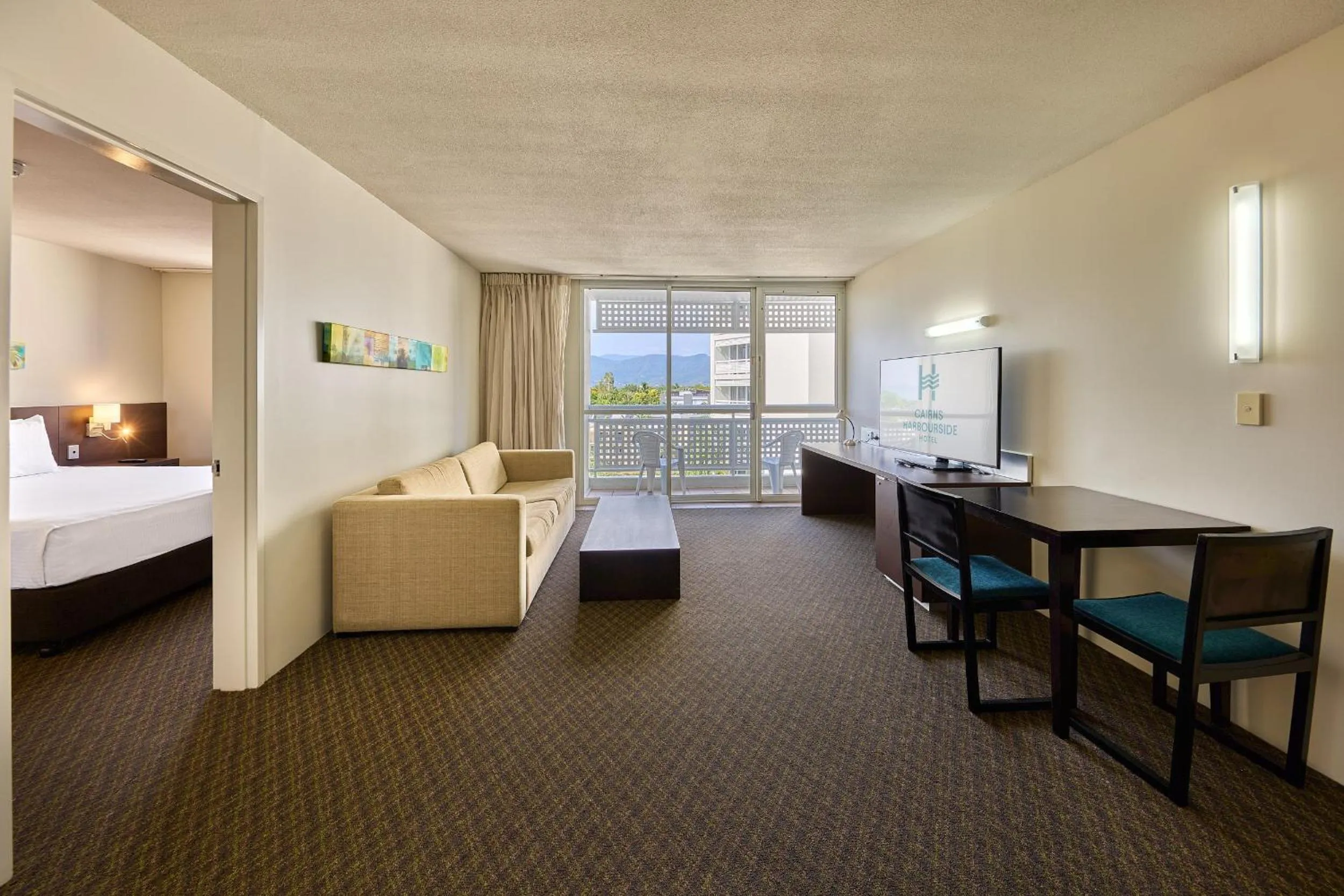Living room, Bed in Cairns Harbourside Hotel