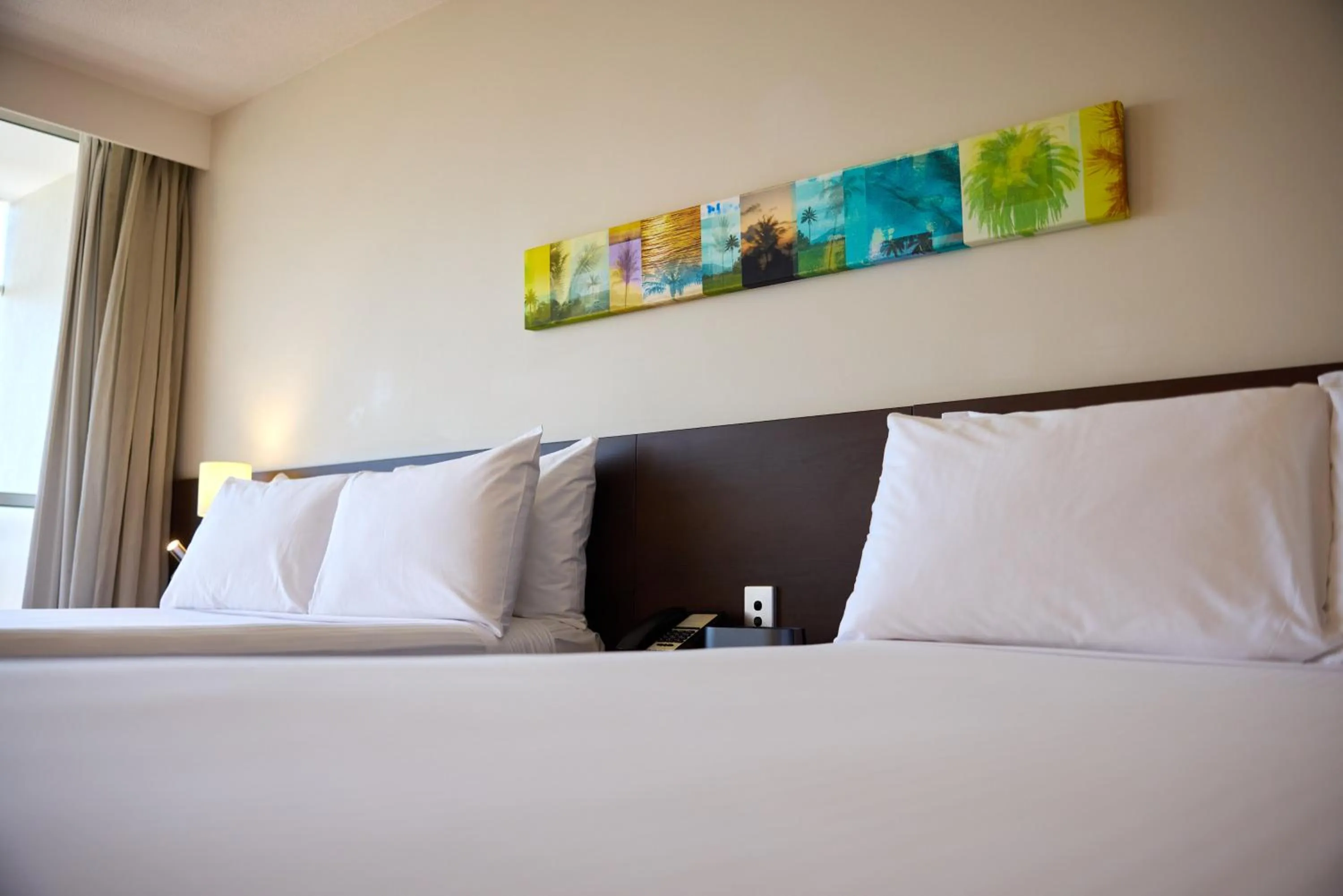 Bed in Cairns Harbourside Hotel