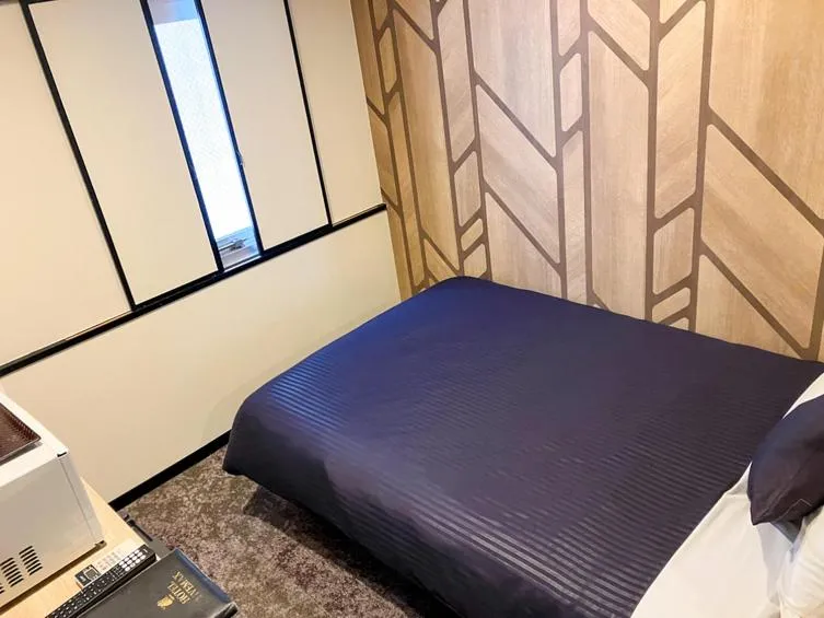 Bed in HOTEL LiVEMAX BUDGET Naha