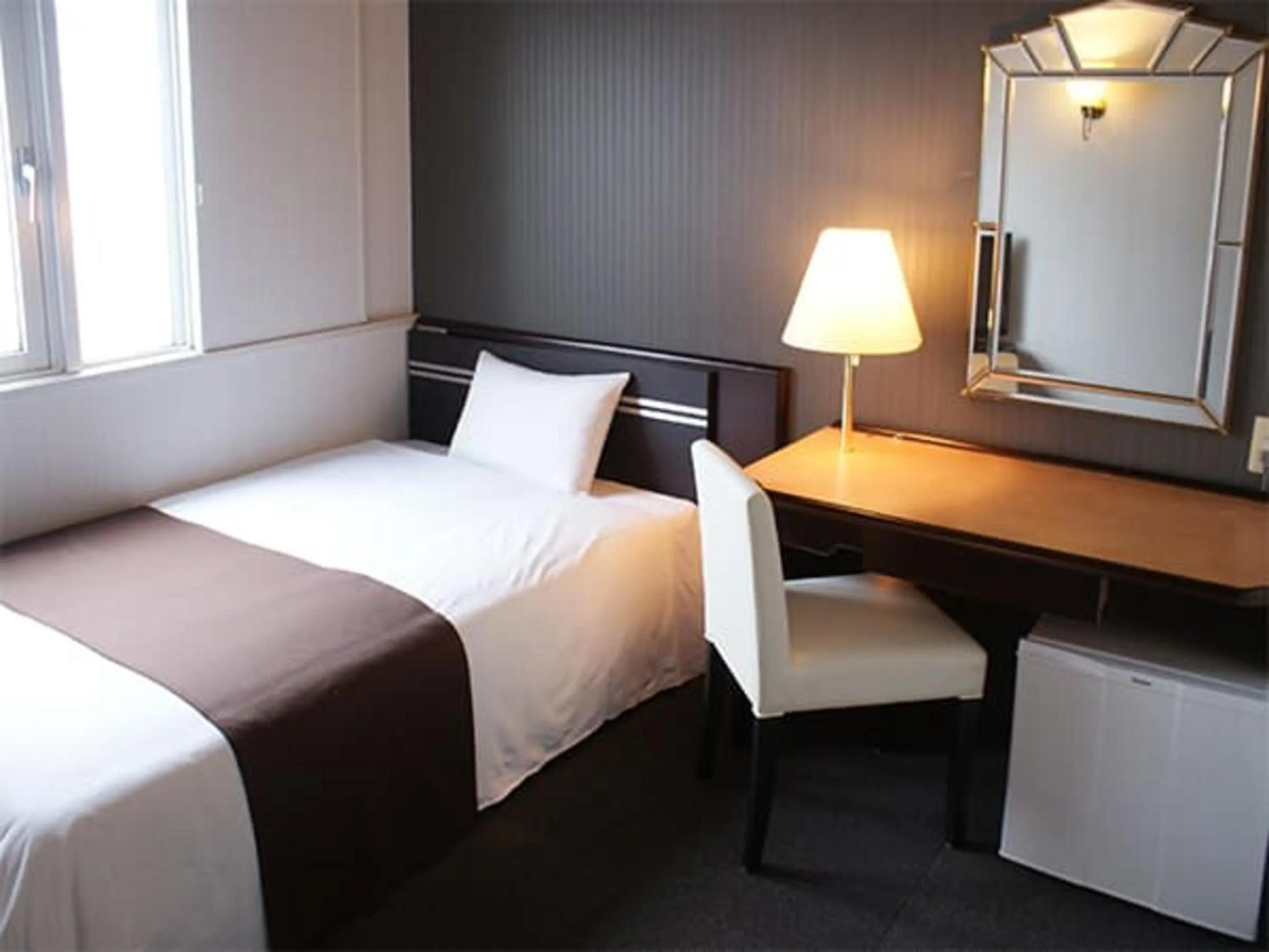 Bed in HOTEL LiVEMAX BUDGET Naha