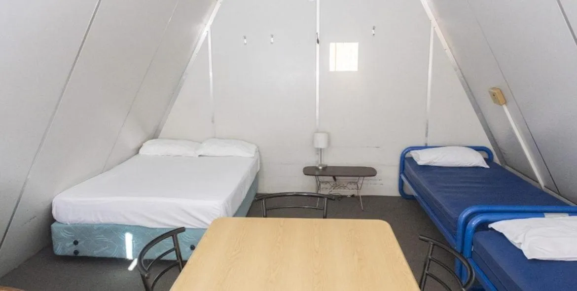 Bed in Rangiora Eco Holiday Park