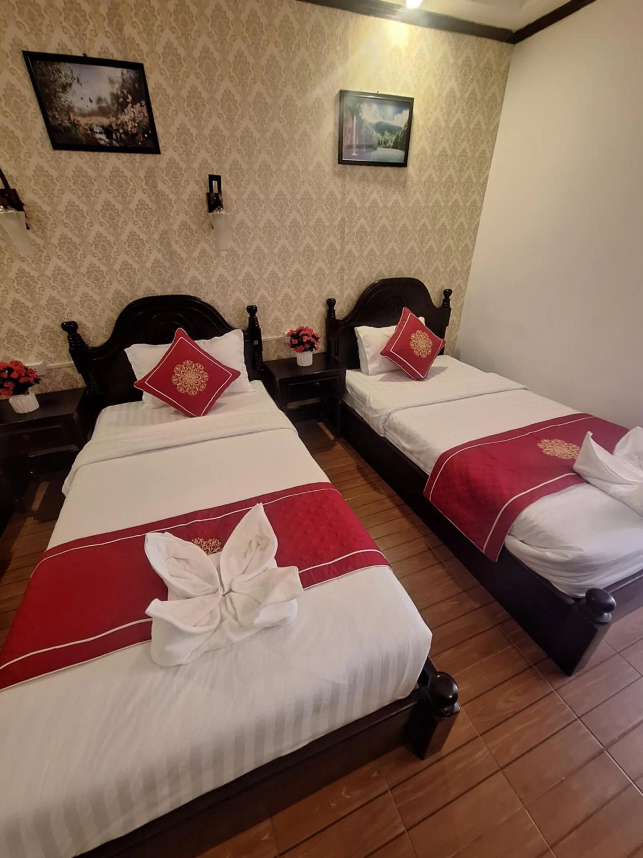 Bed in Luang Prabang Pavilion Hotel & Travel