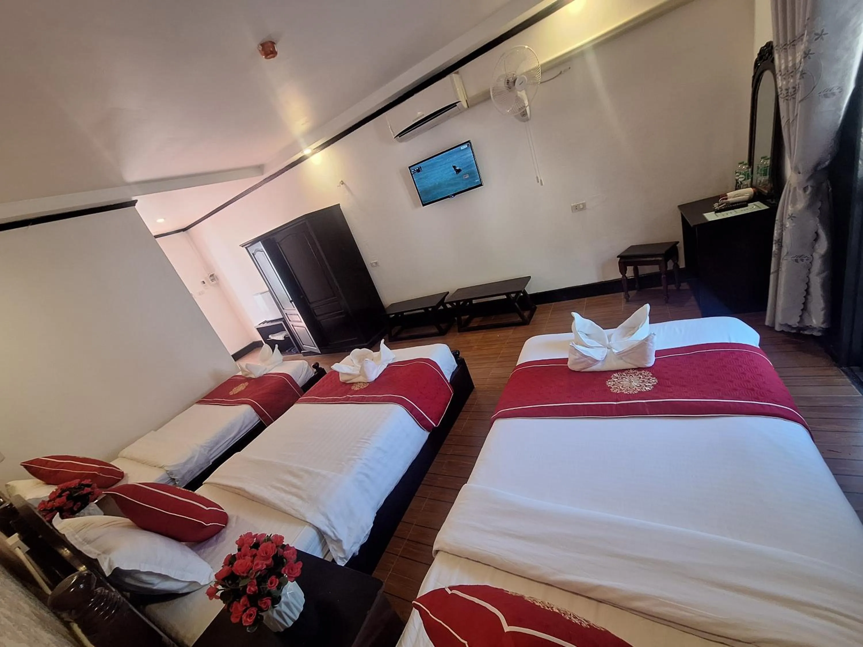 Bed in Luang Prabang Pavilion Hotel & Travel