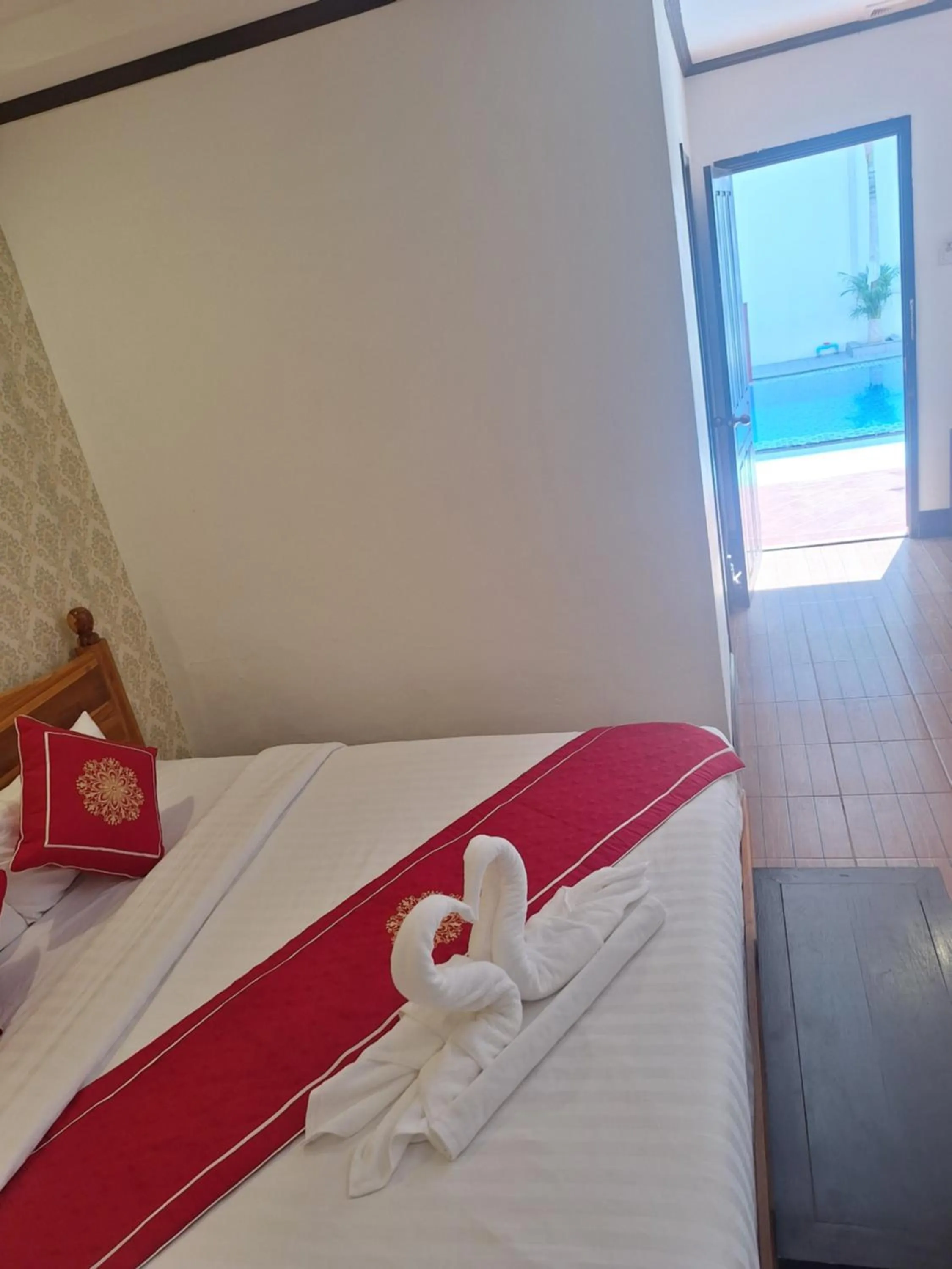 Bed in Luang Prabang Pavilion Hotel & Travel