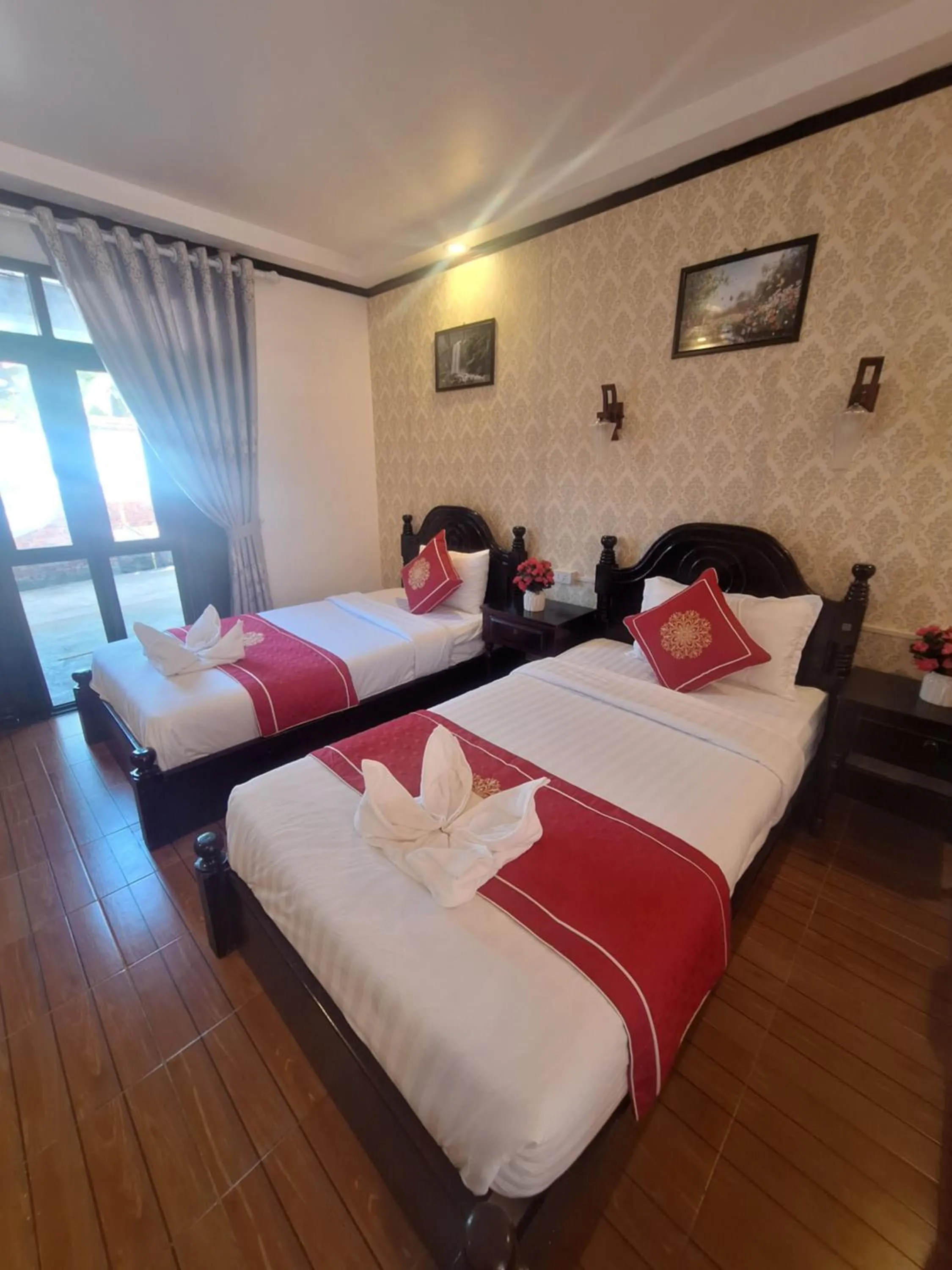 Bed in Luang Prabang Pavilion Hotel & Travel