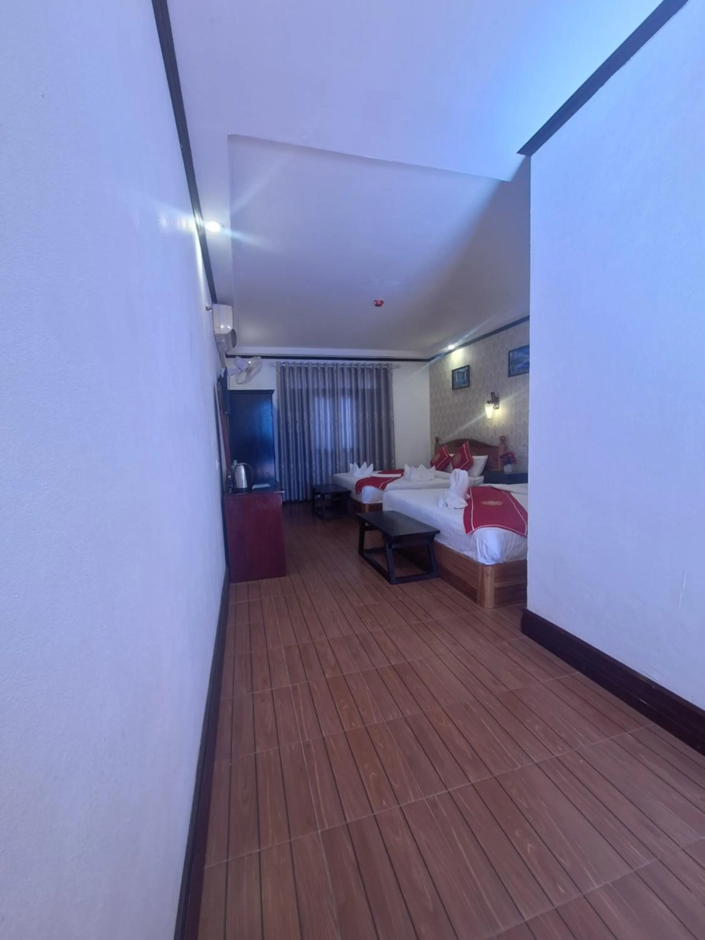 Bed in Luang Prabang Pavilion Hotel & Travel