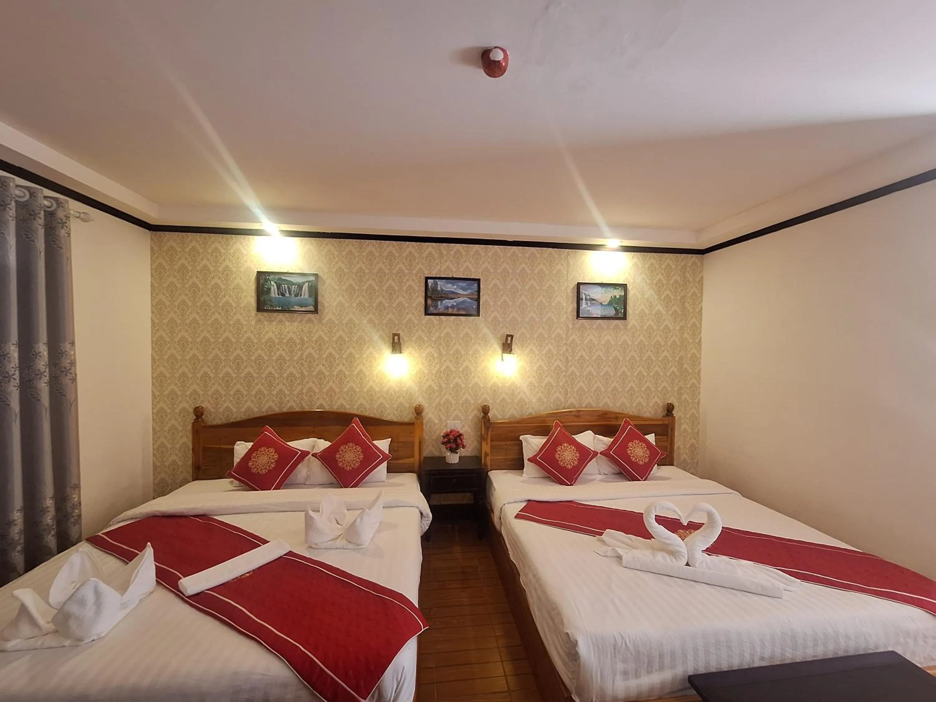 Bed in Luang Prabang Pavilion Hotel & Travel