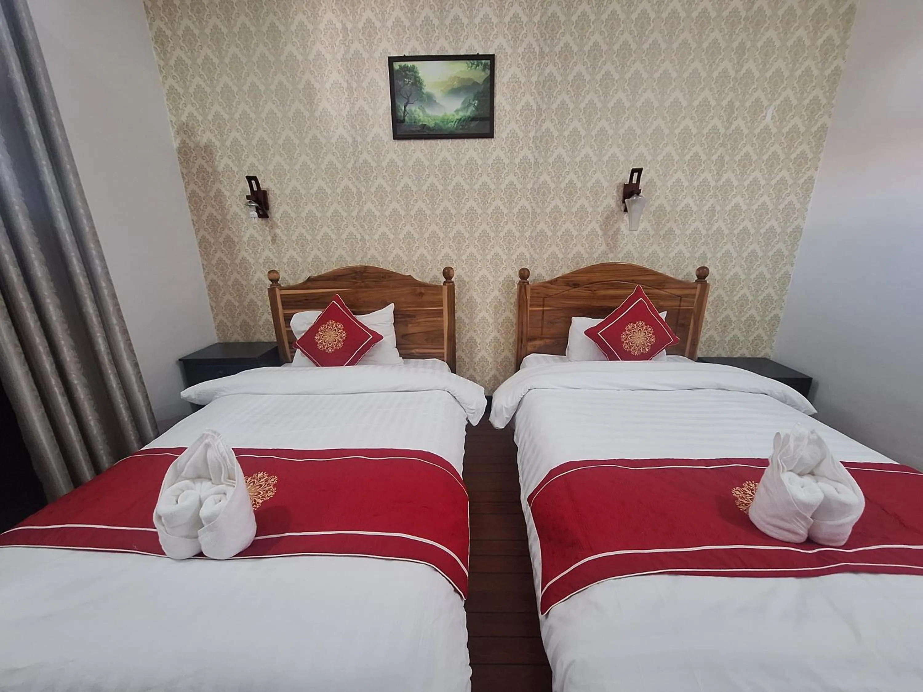 Bed in Luang Prabang Pavilion Hotel & Travel