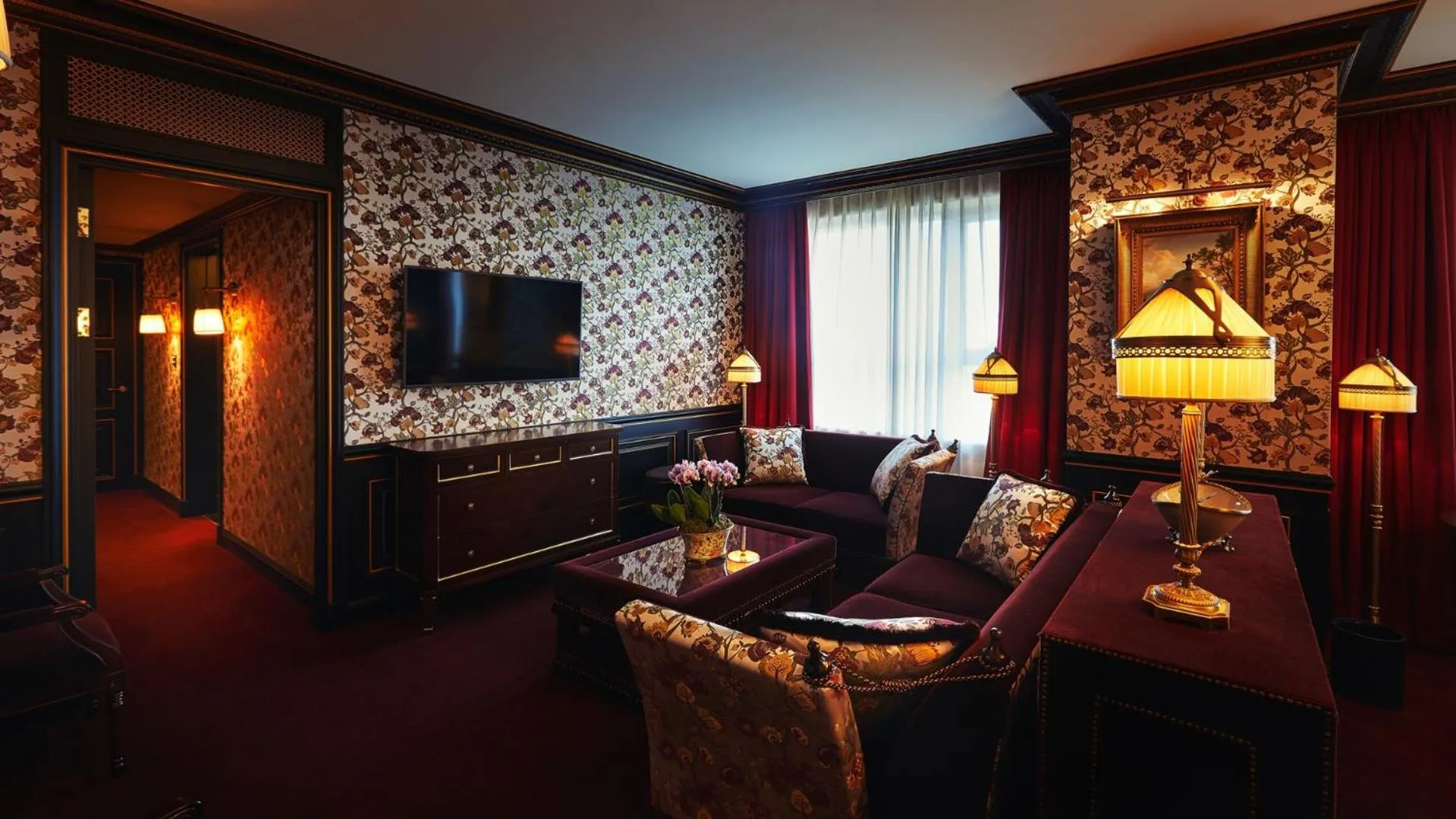 Communal lounge/ TV room in L'Escape Hotel