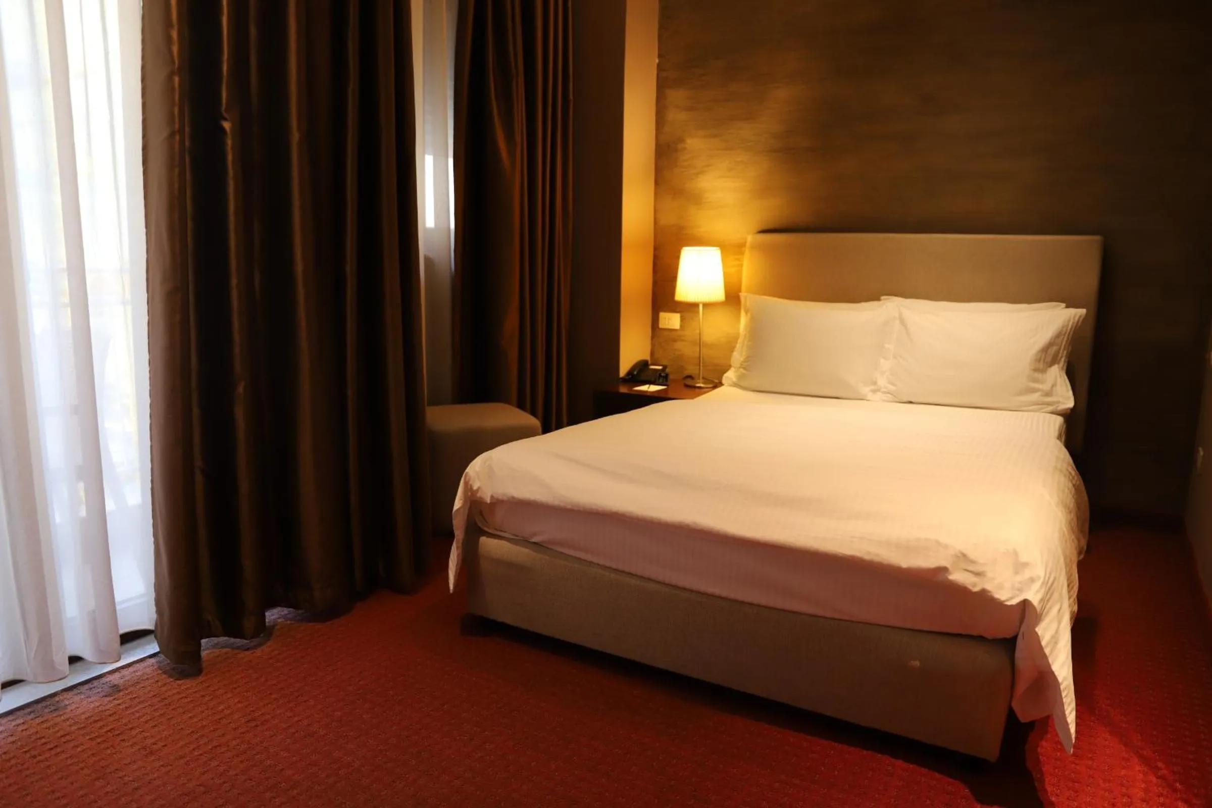 Bed in Mondial Hotel