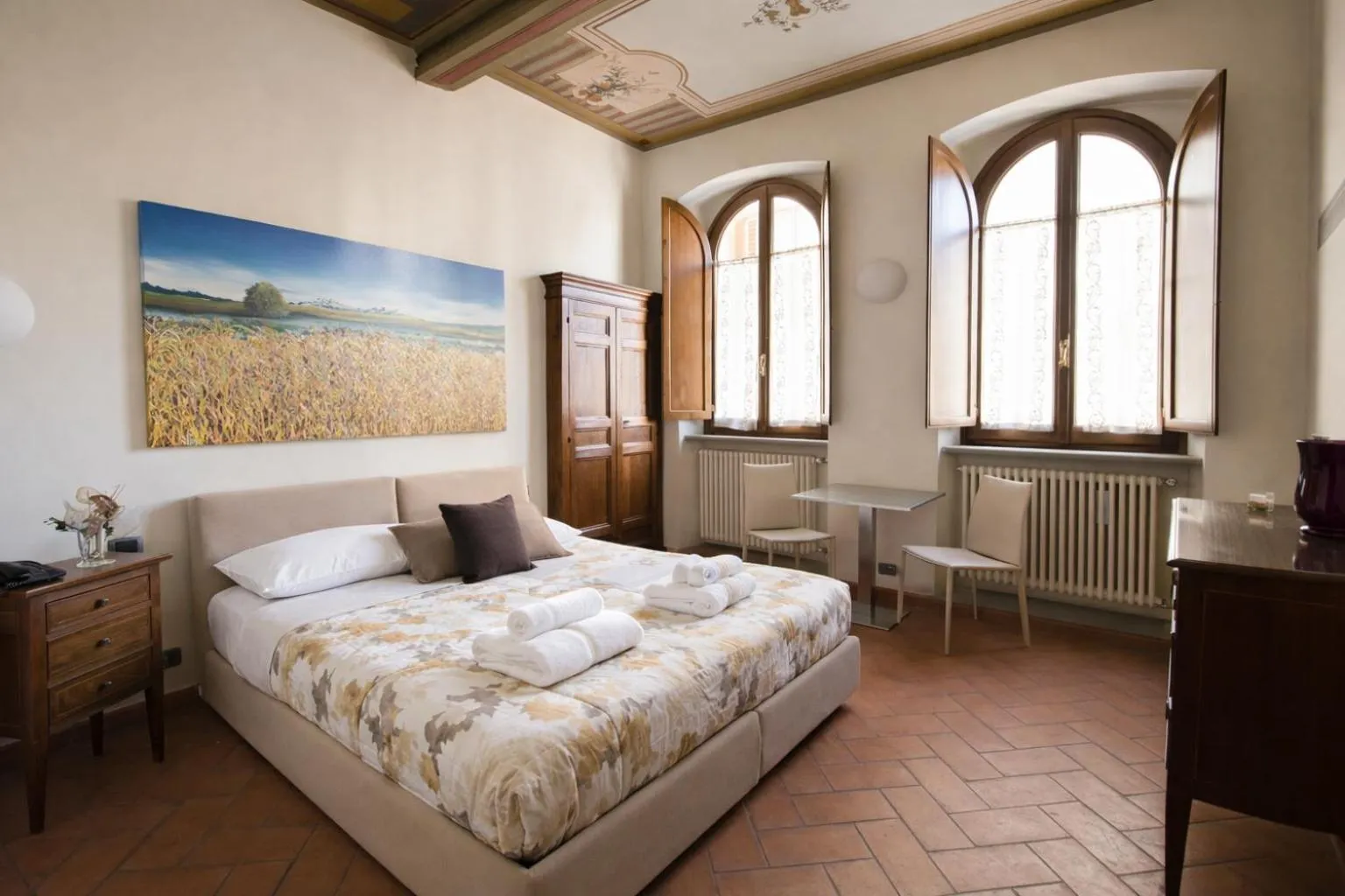 Bed in La Corte Del Re Suite & Rooms Arezzo