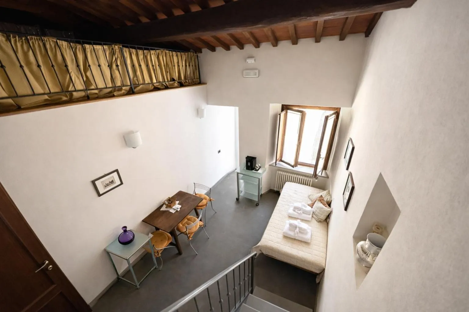 Bed in La Corte Del Re Suite & Rooms Arezzo