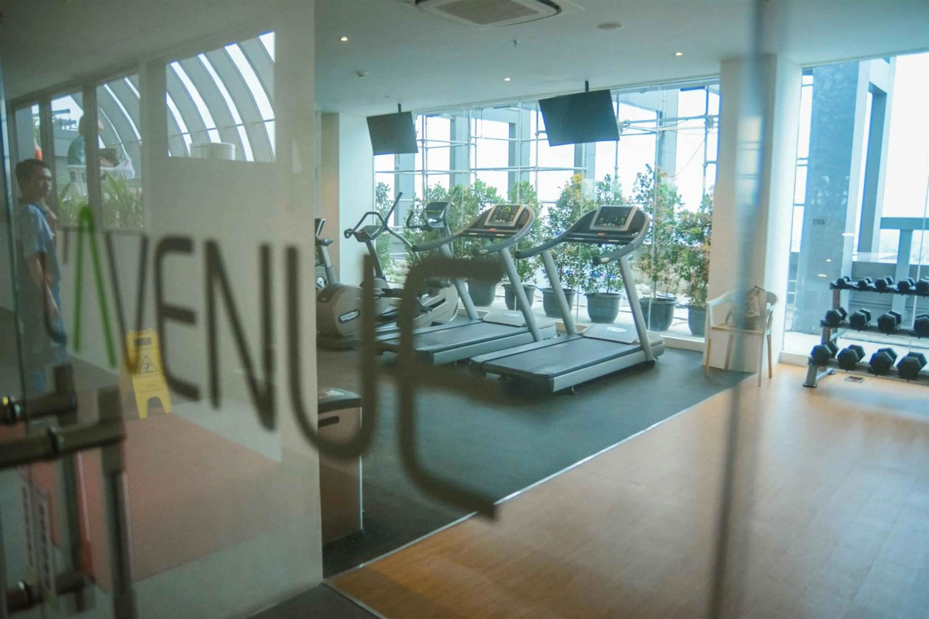 Fitness centre/facilities in Modern Elegant Design 2BR L'Avenue Apartment By Travelio