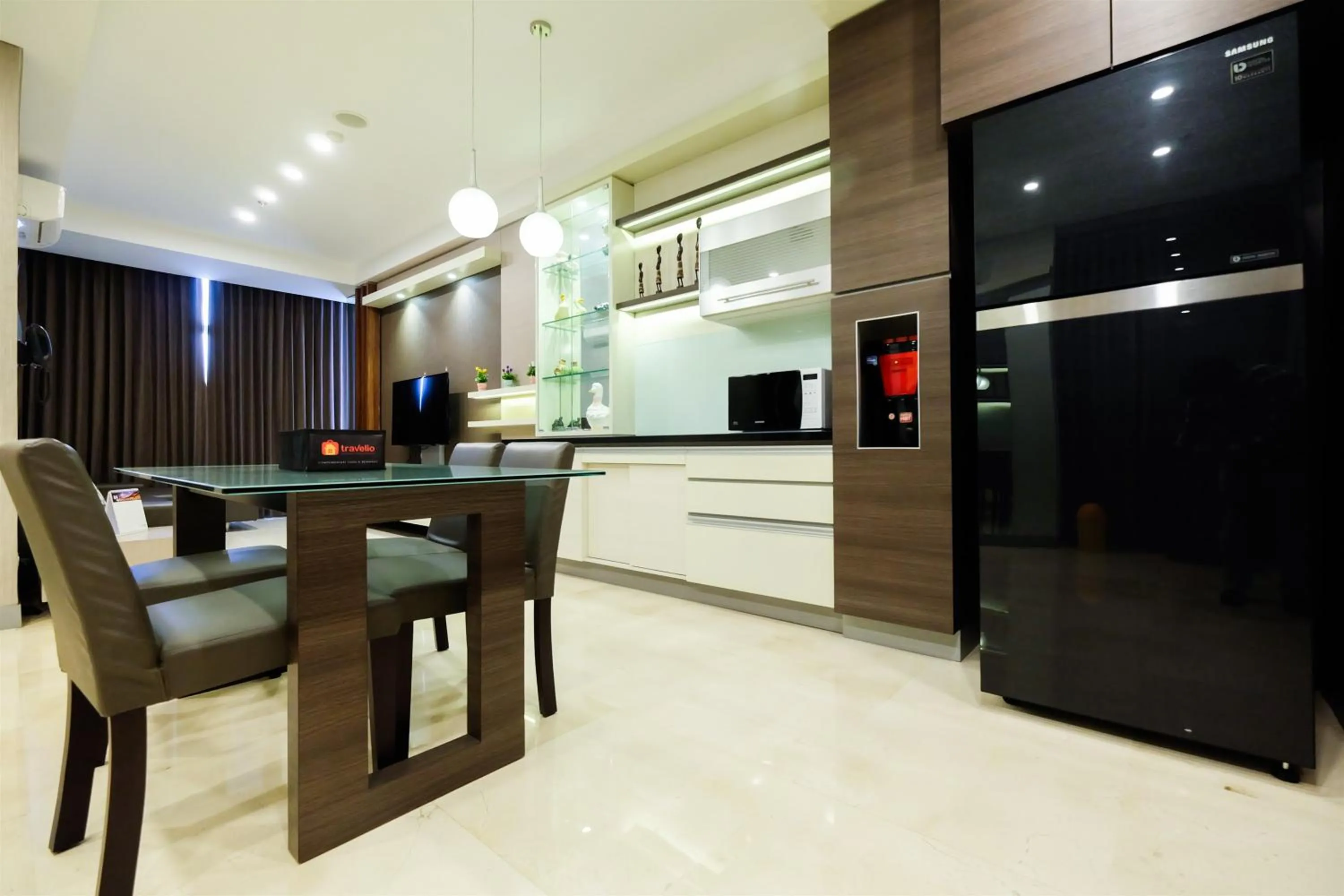 Kitchen or kitchenette in Modern Elegant Design 2BR L'Avenue Apartment By Travelio