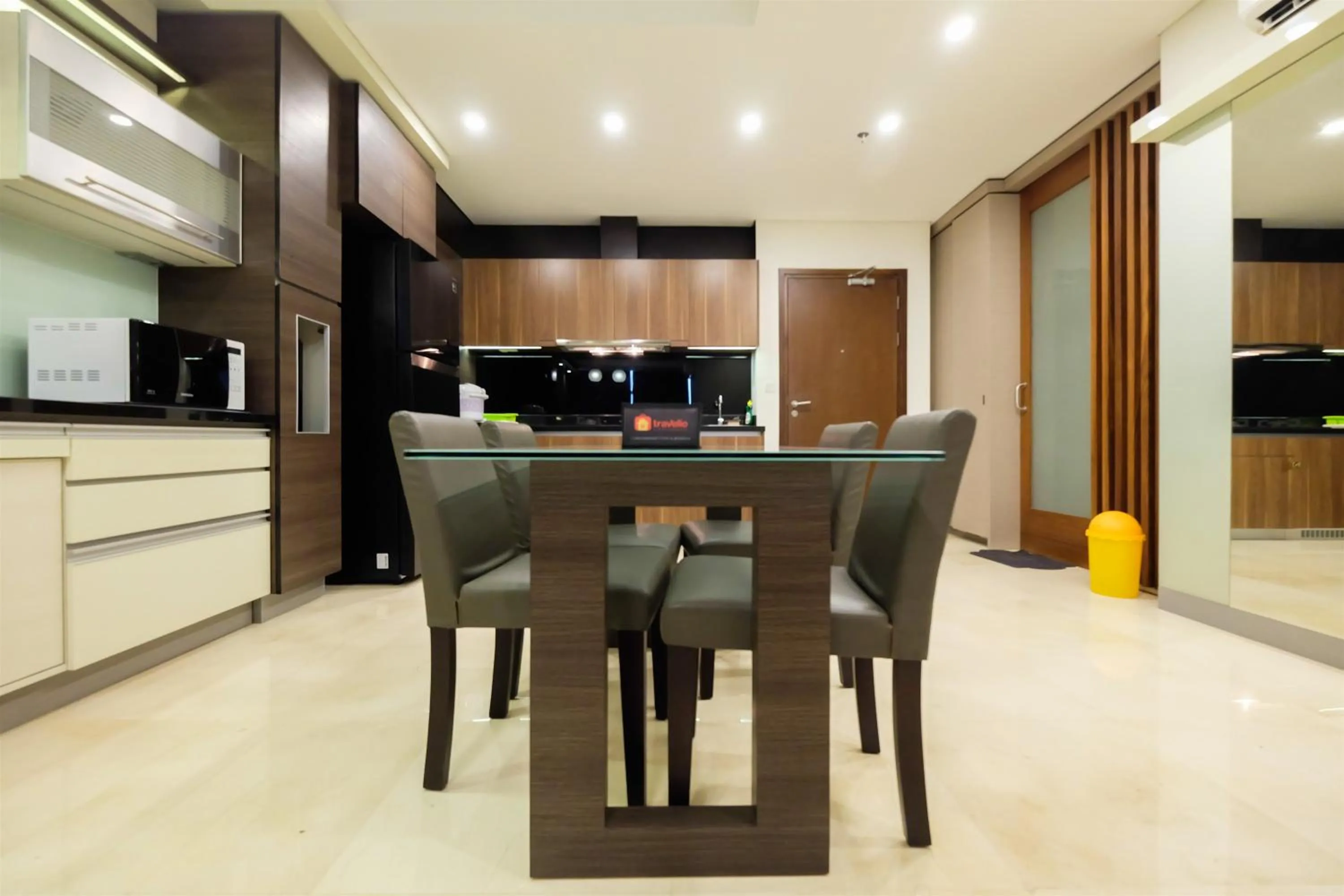 Kitchen or kitchenette in Modern Elegant Design 2BR L'Avenue Apartment By Travelio