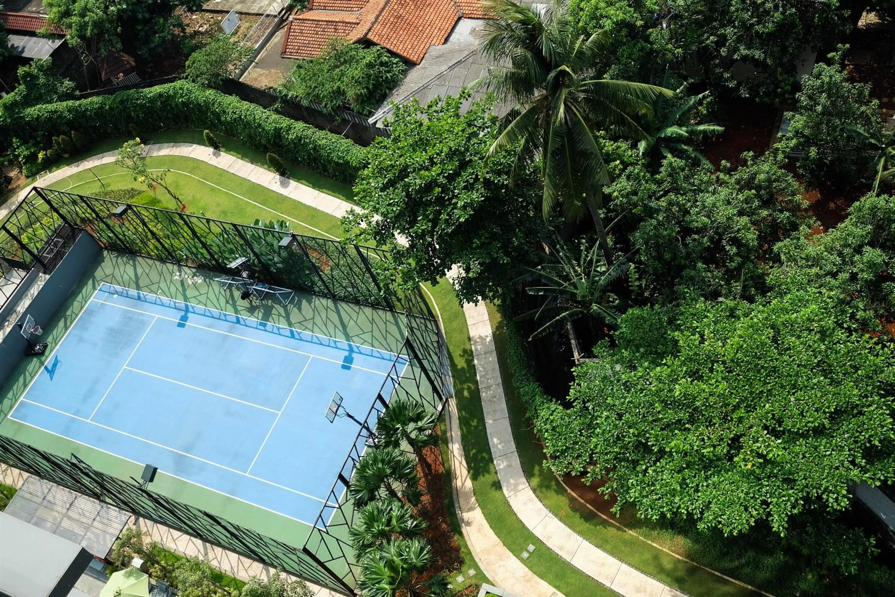 Tennis court in Modern Elegant Design 2BR L'Avenue Apartment By Travelio