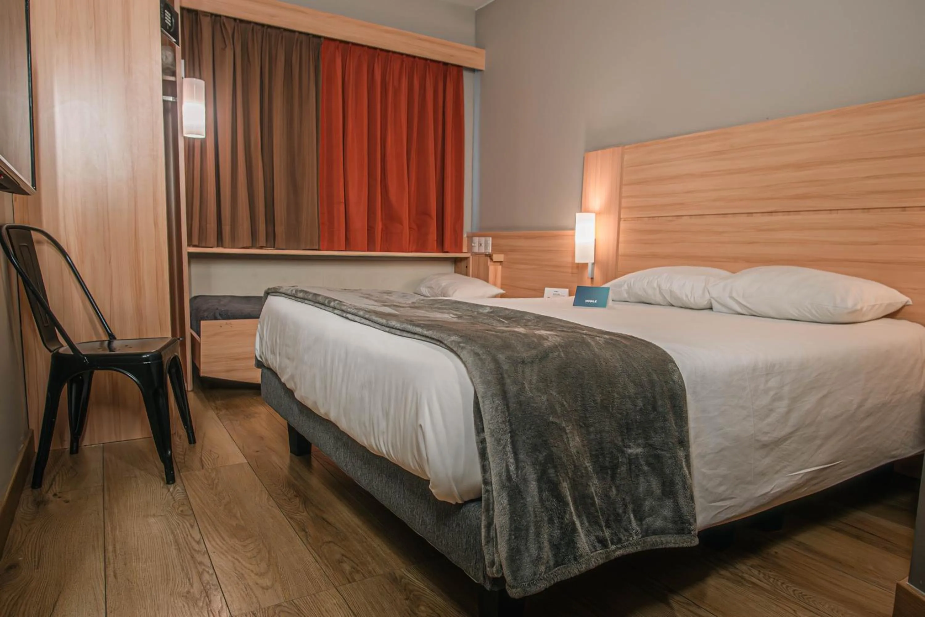 Photo of the whole room, Bed in Nobile Inn Santiago