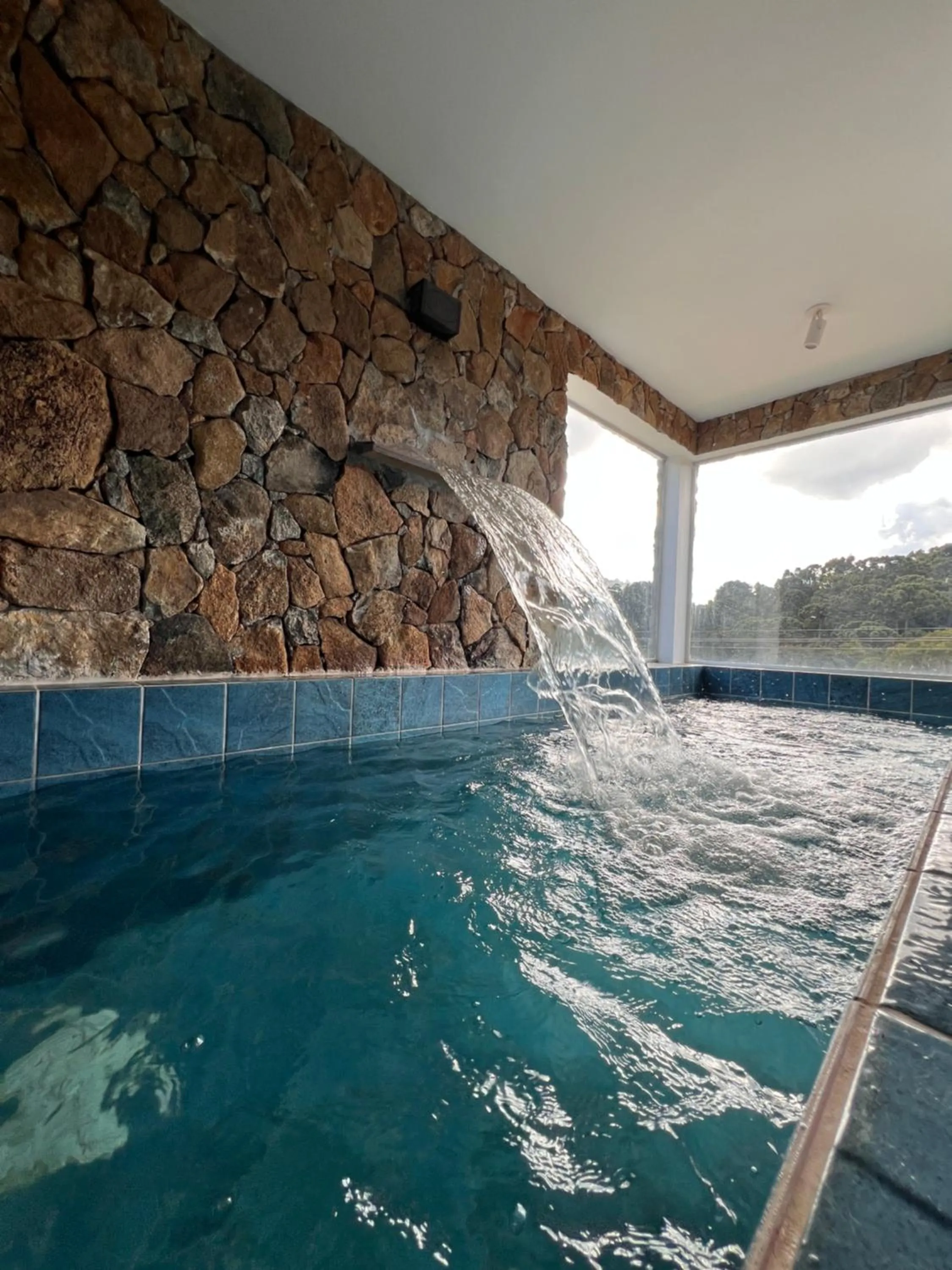 Swimming pool in Pousada Jardim das Montanhas