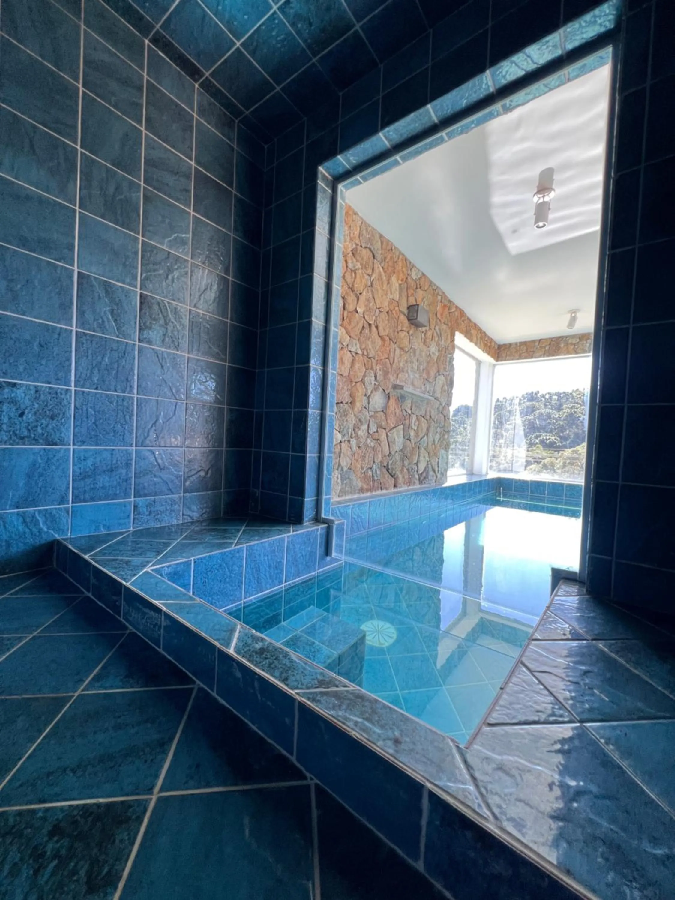 Swimming pool in Pousada Jardim das Montanhas