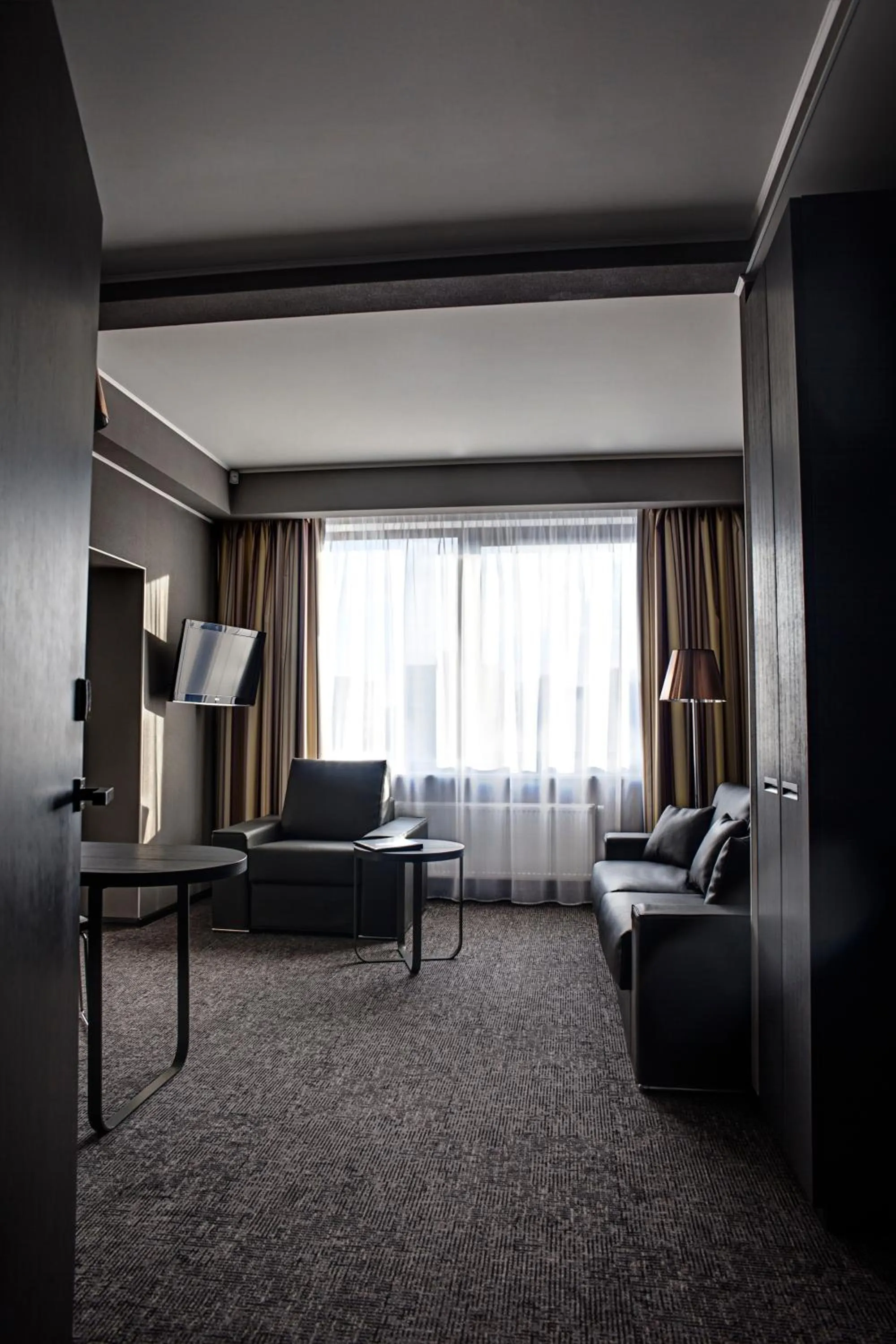 Living room, Bed in Mercure Kyiv Congress