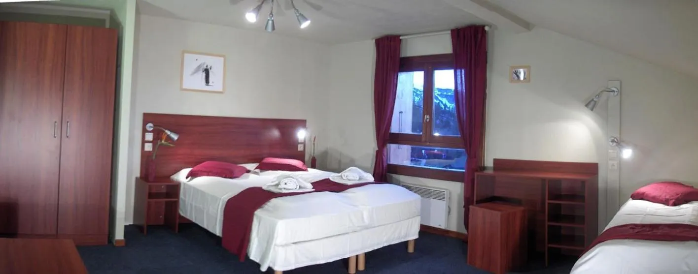 Standard Quadruple Room in Hotel Chalet du Crey