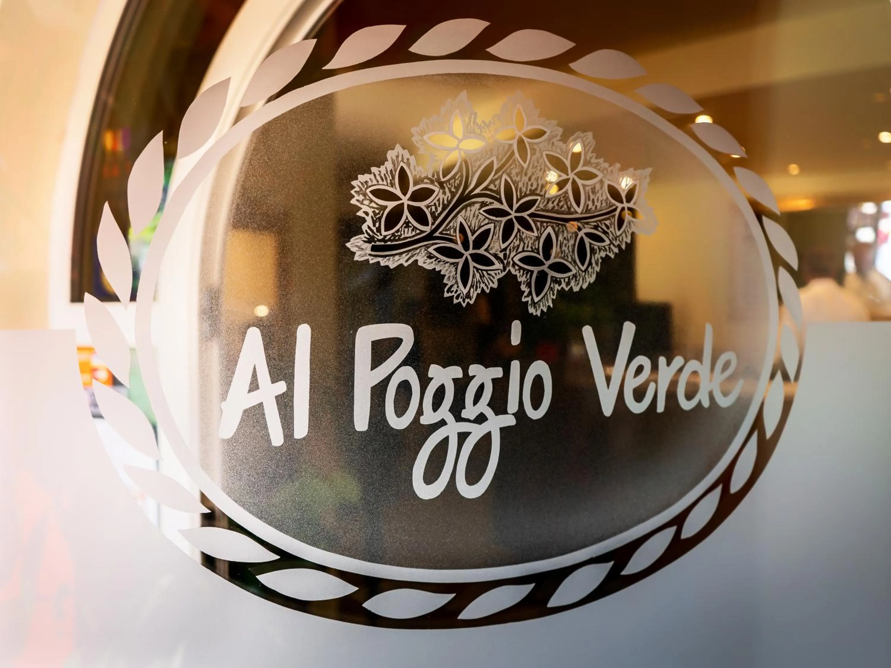 Property logo or sign in Hotel Al Poggio Verde