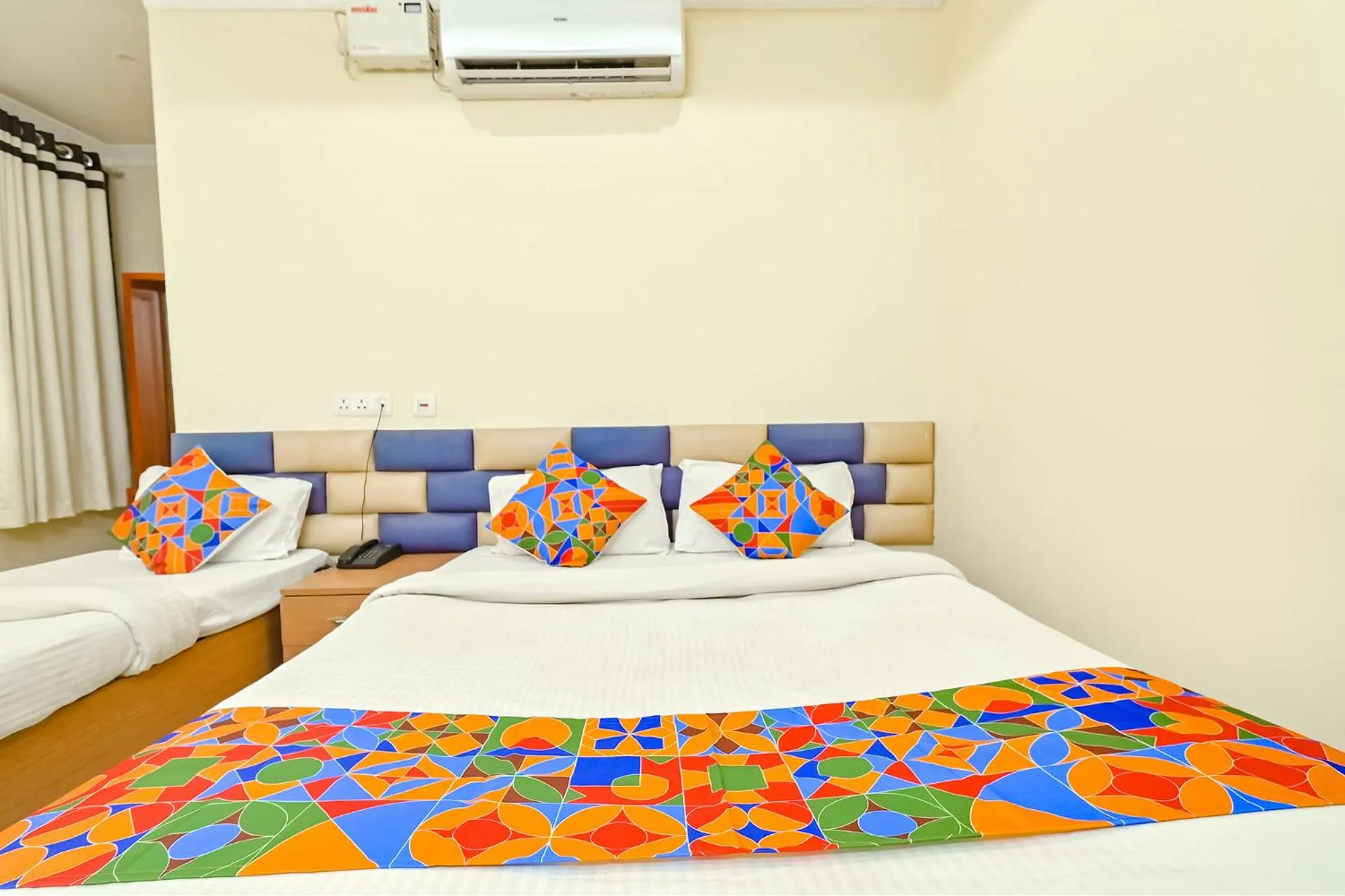 Bed in FabHotel Good Luck Residency