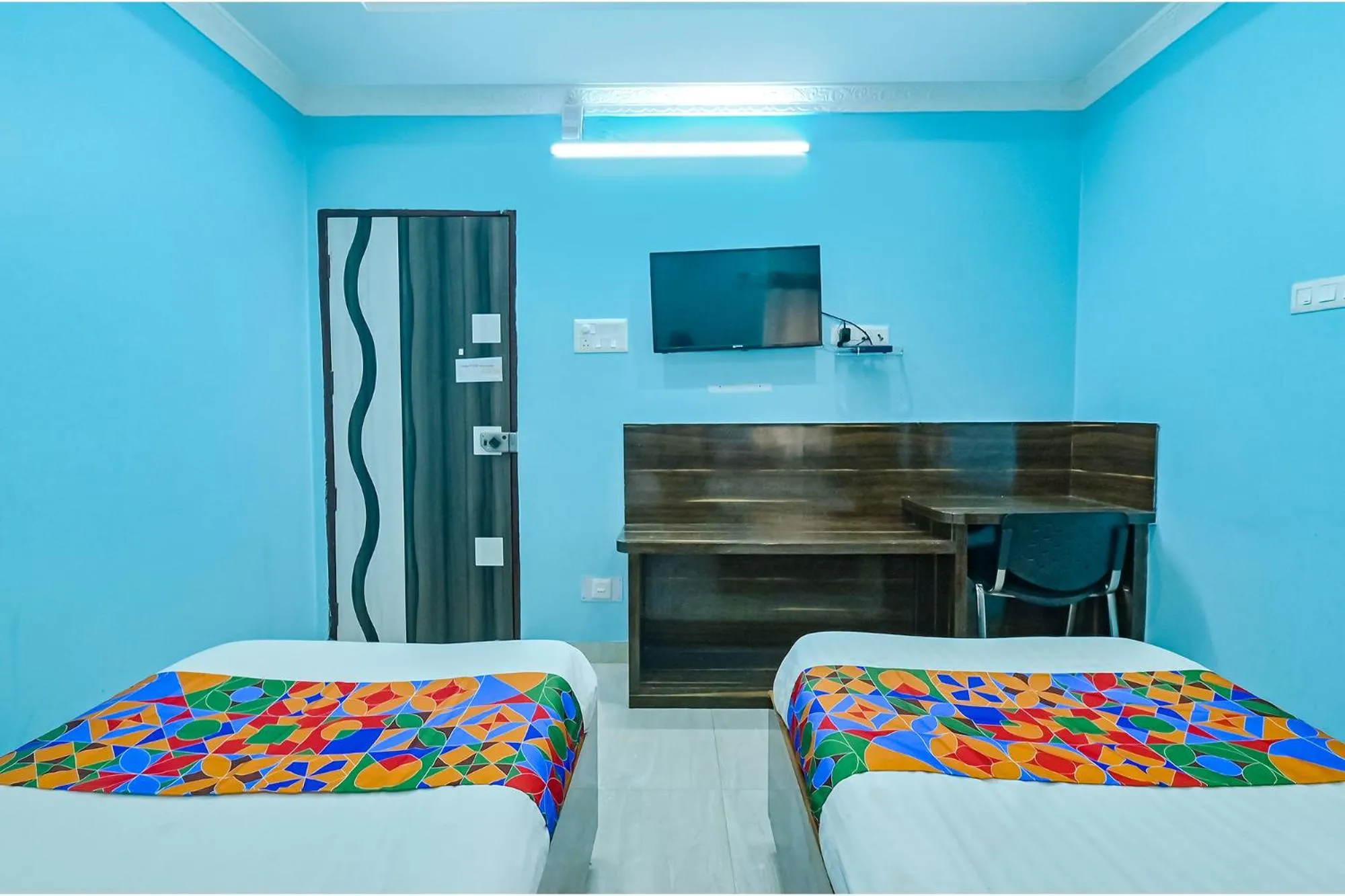 Bed in FabHotel Good Luck Residency