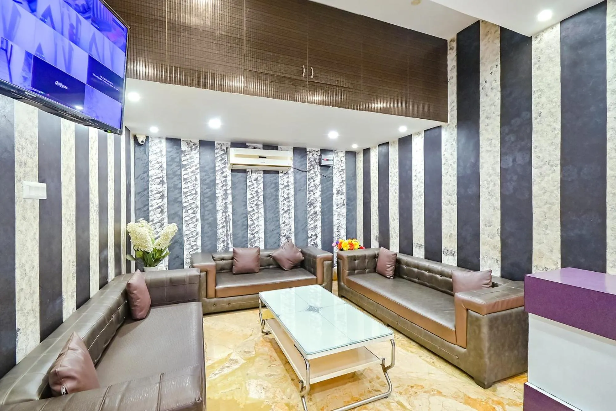 Seating area in FabHotel Good Luck Residency