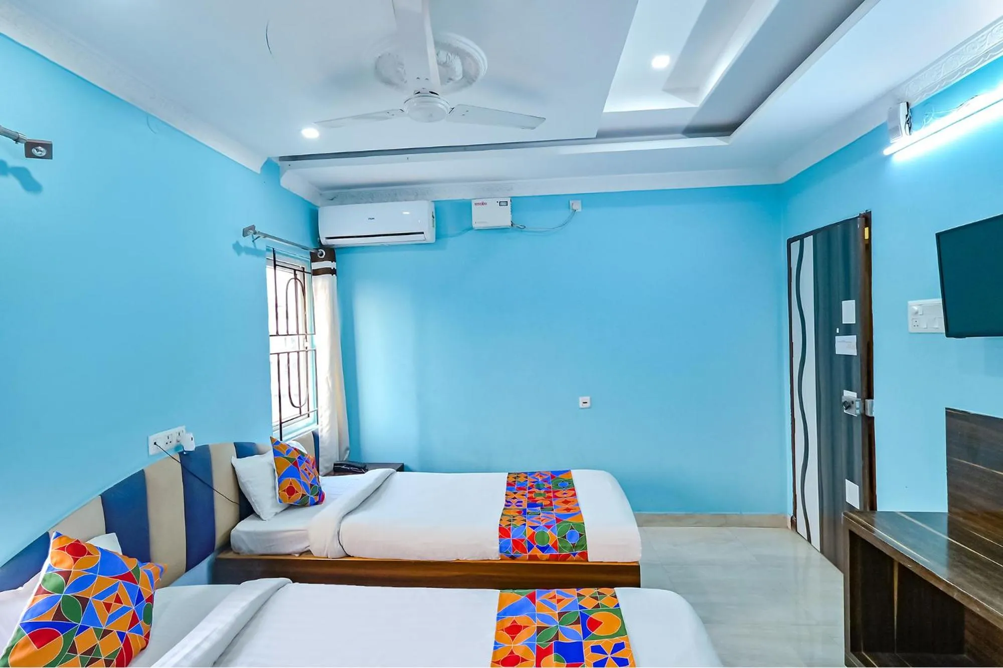 Bed in FabHotel Good Luck Residency