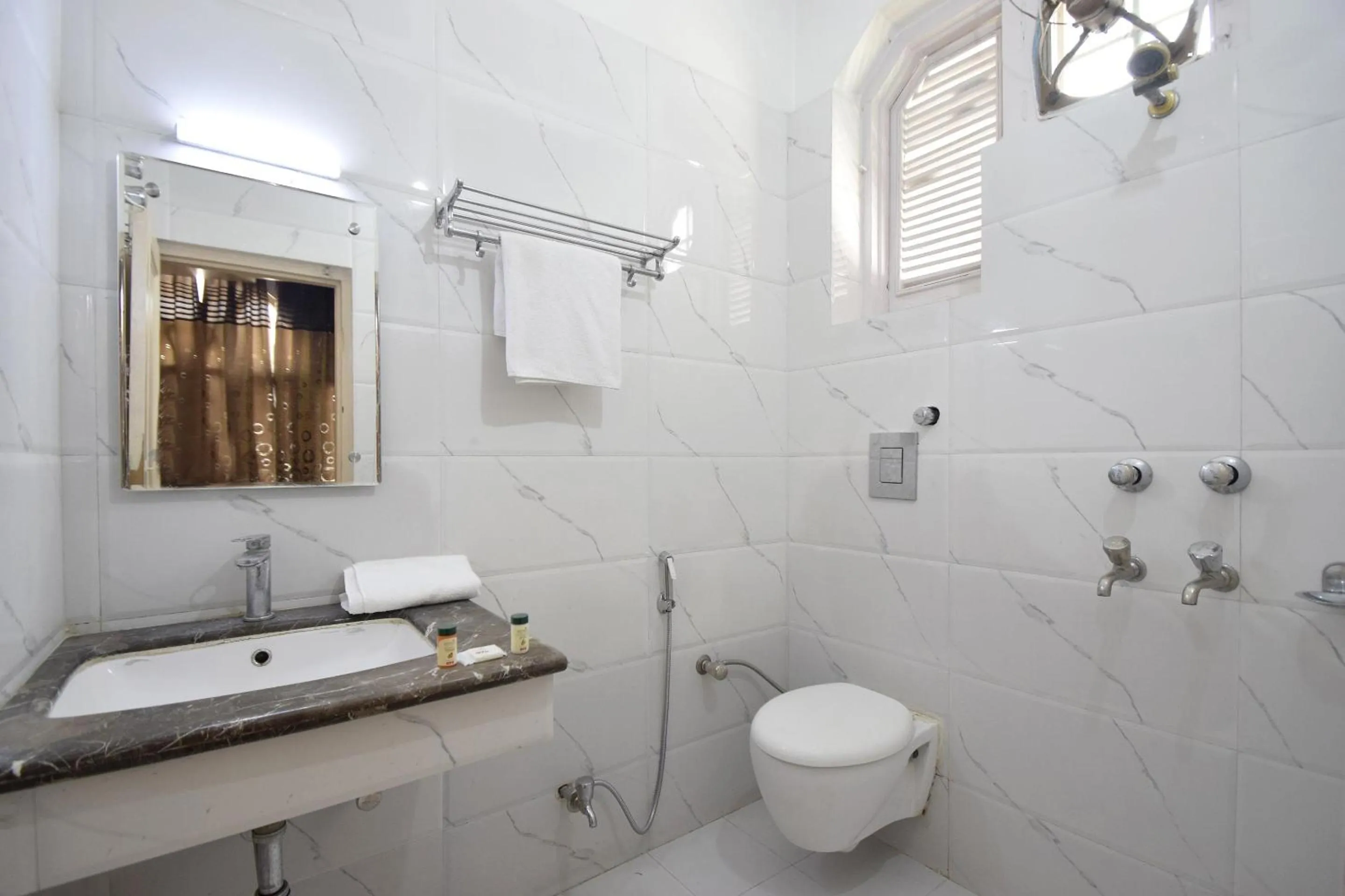 Bathroom in Super Hotel O Maa Residency