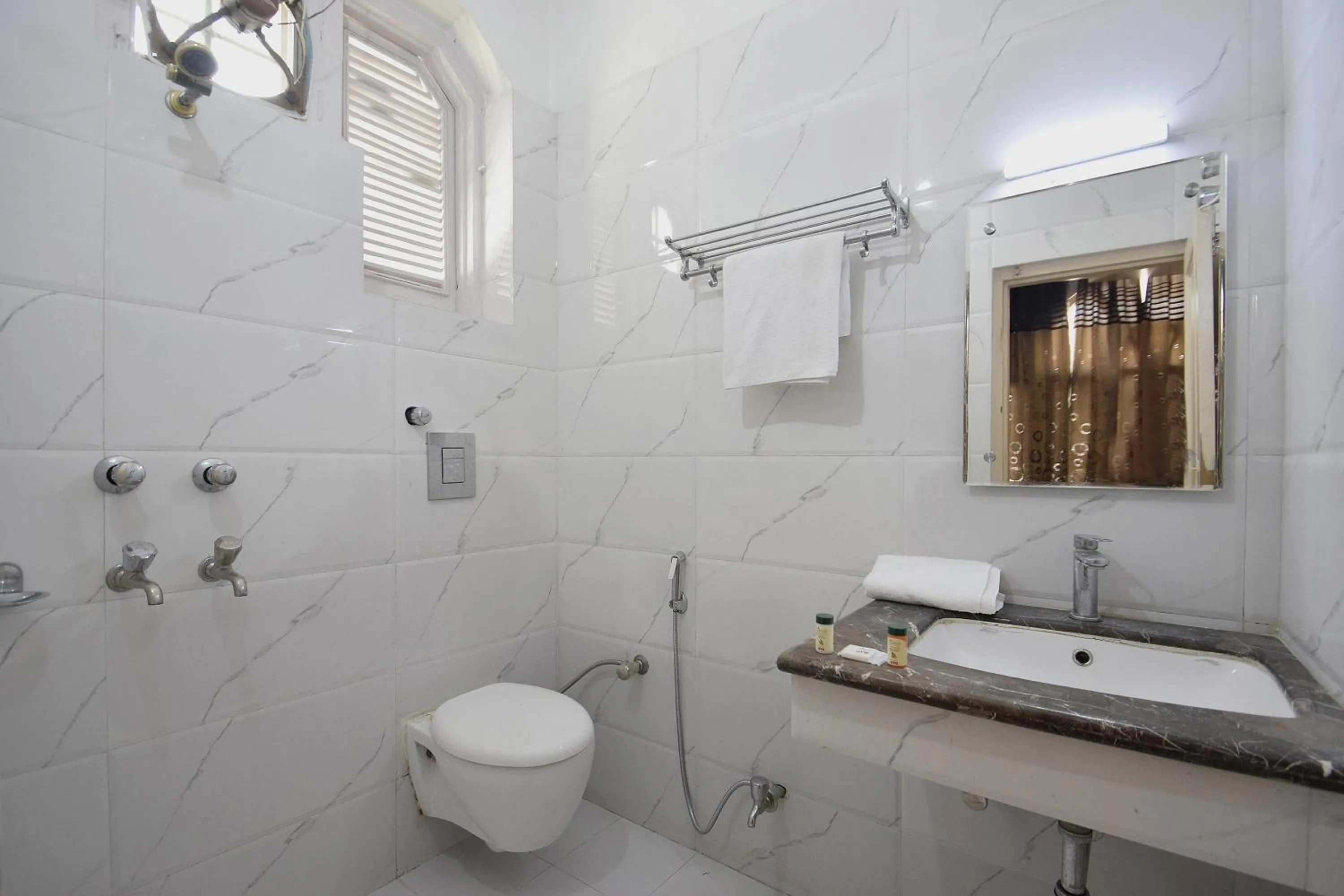 Bathroom in Super Hotel O Maa Residency