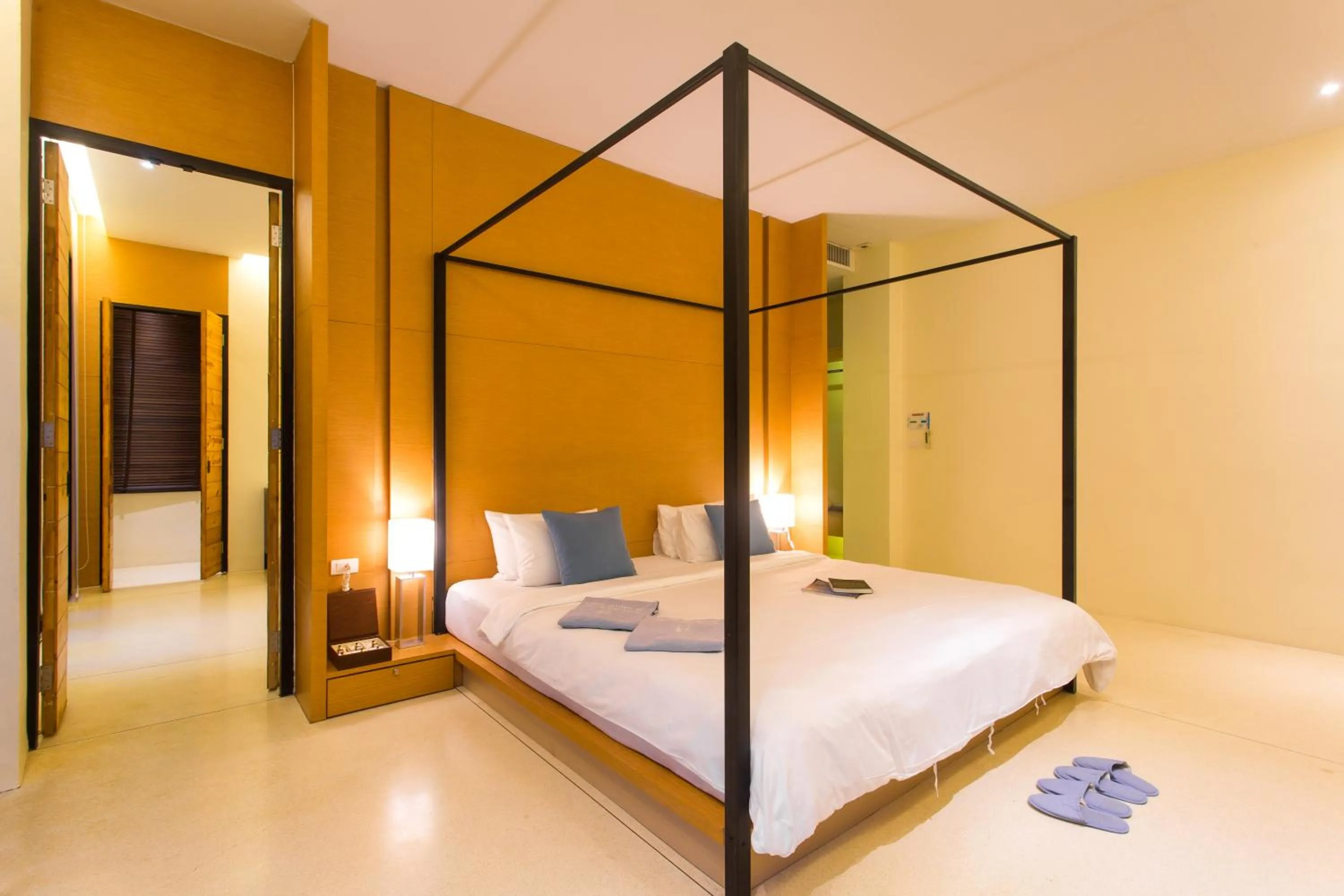 Bed in The Anda Mani Khaolak Beachfront Villas - Adult only