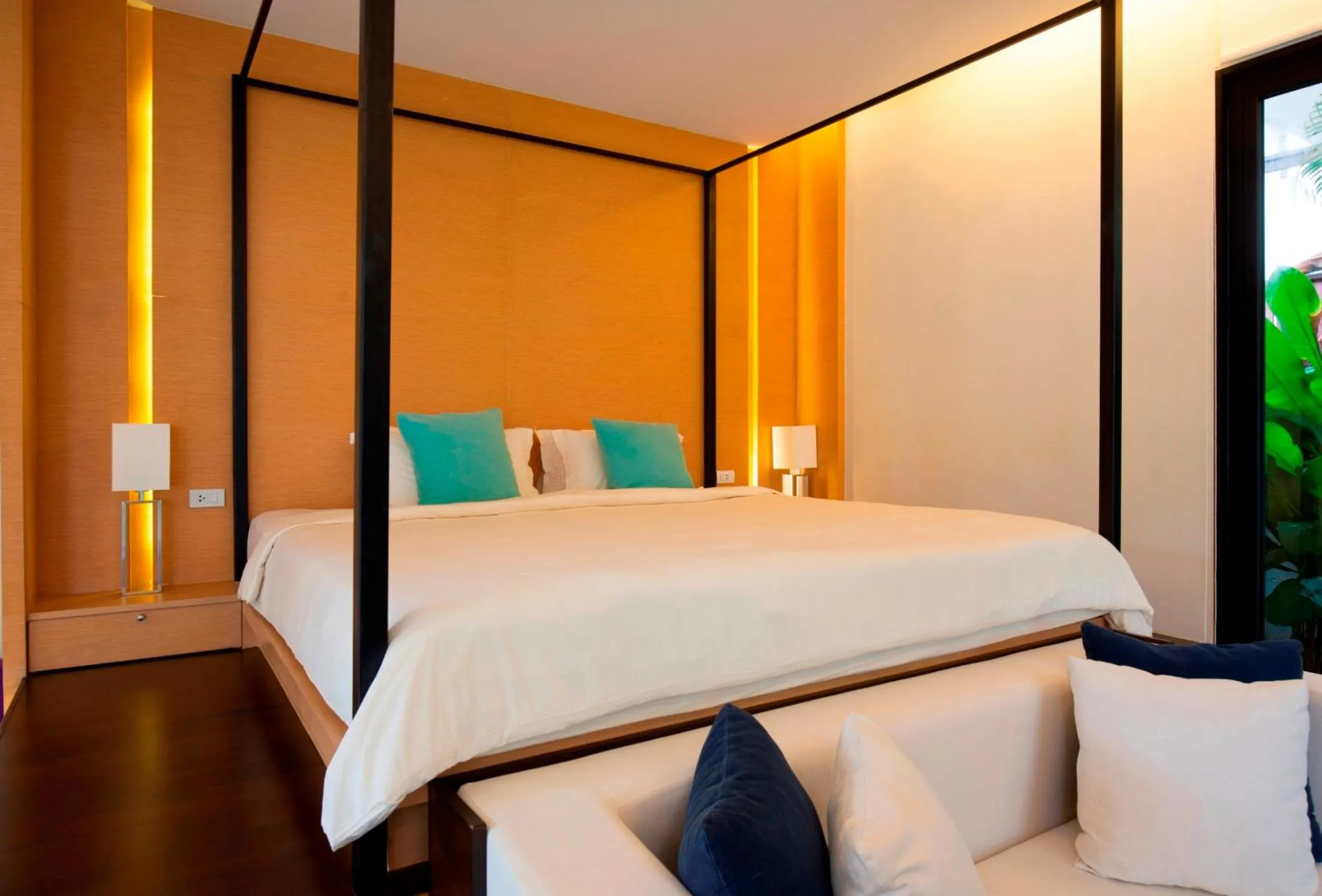 Bed in The Anda Mani Khaolak Beachfront Villas - Adult only