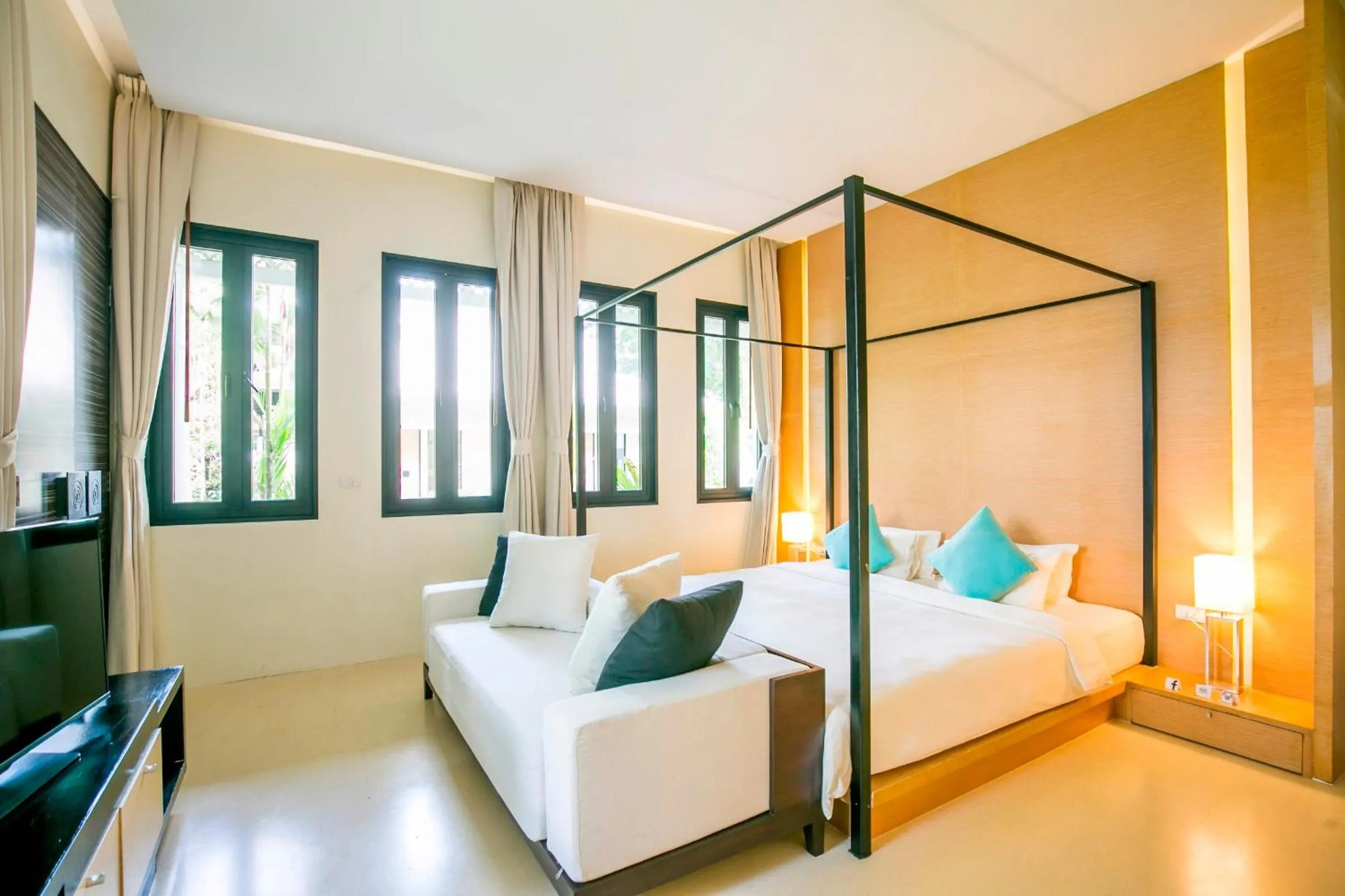 Bed in The Anda Mani Khaolak Beachfront Villas - Adult only