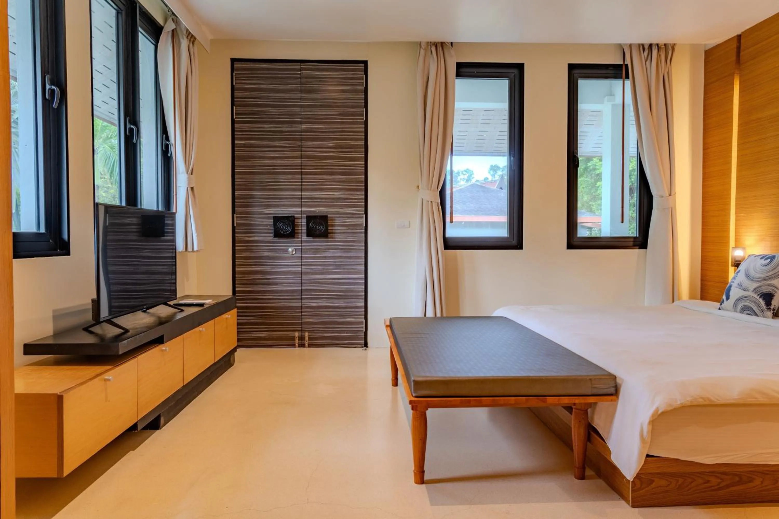 Bed in The Anda Mani Khaolak Beachfront Villas - Adult only